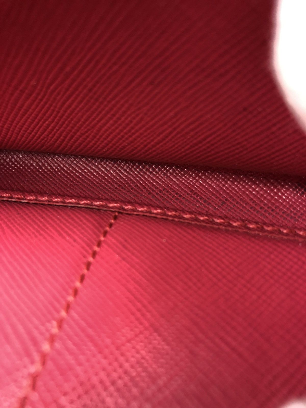 Prada saffiano metal leather zippy wallet