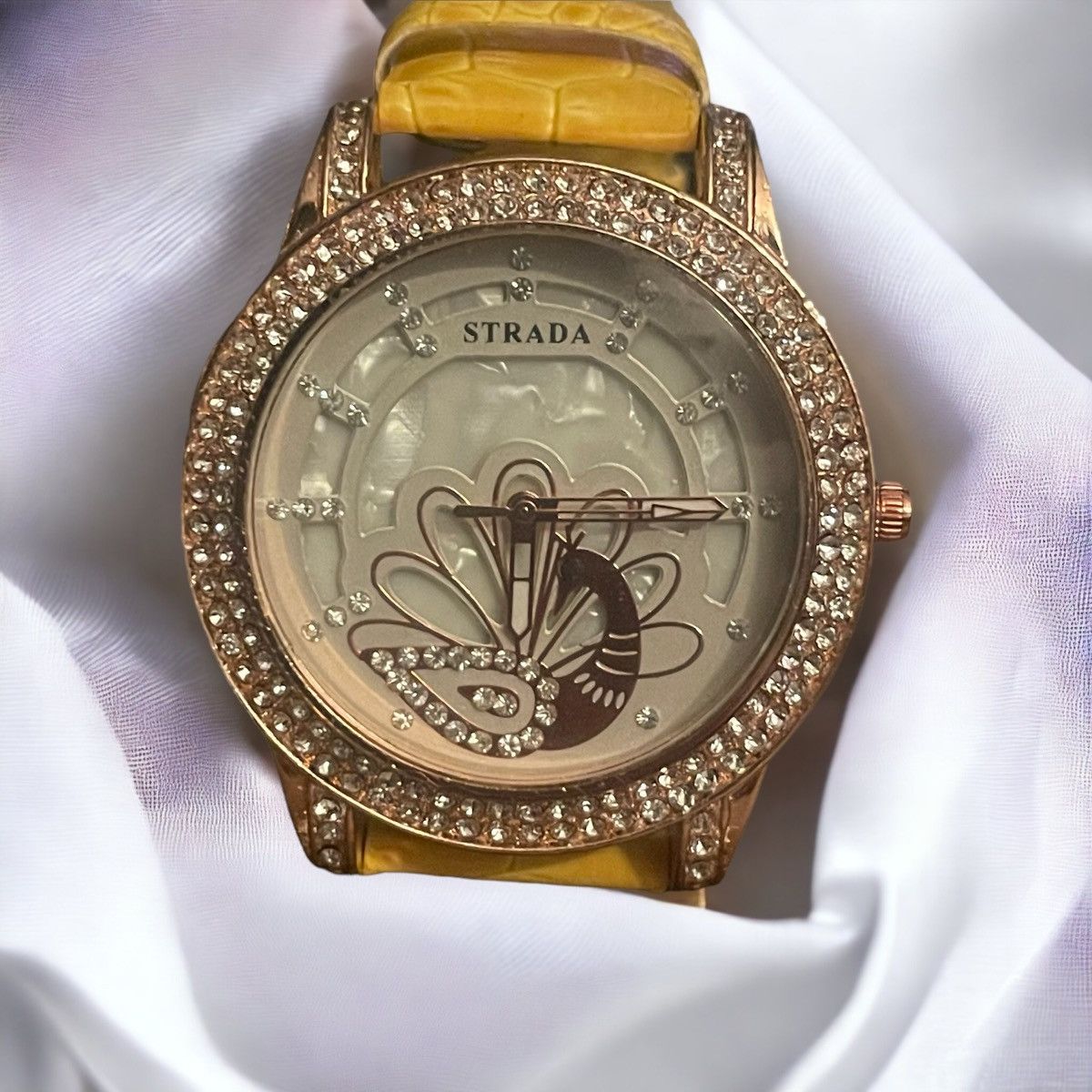 Strada rhinestone peacock face watch