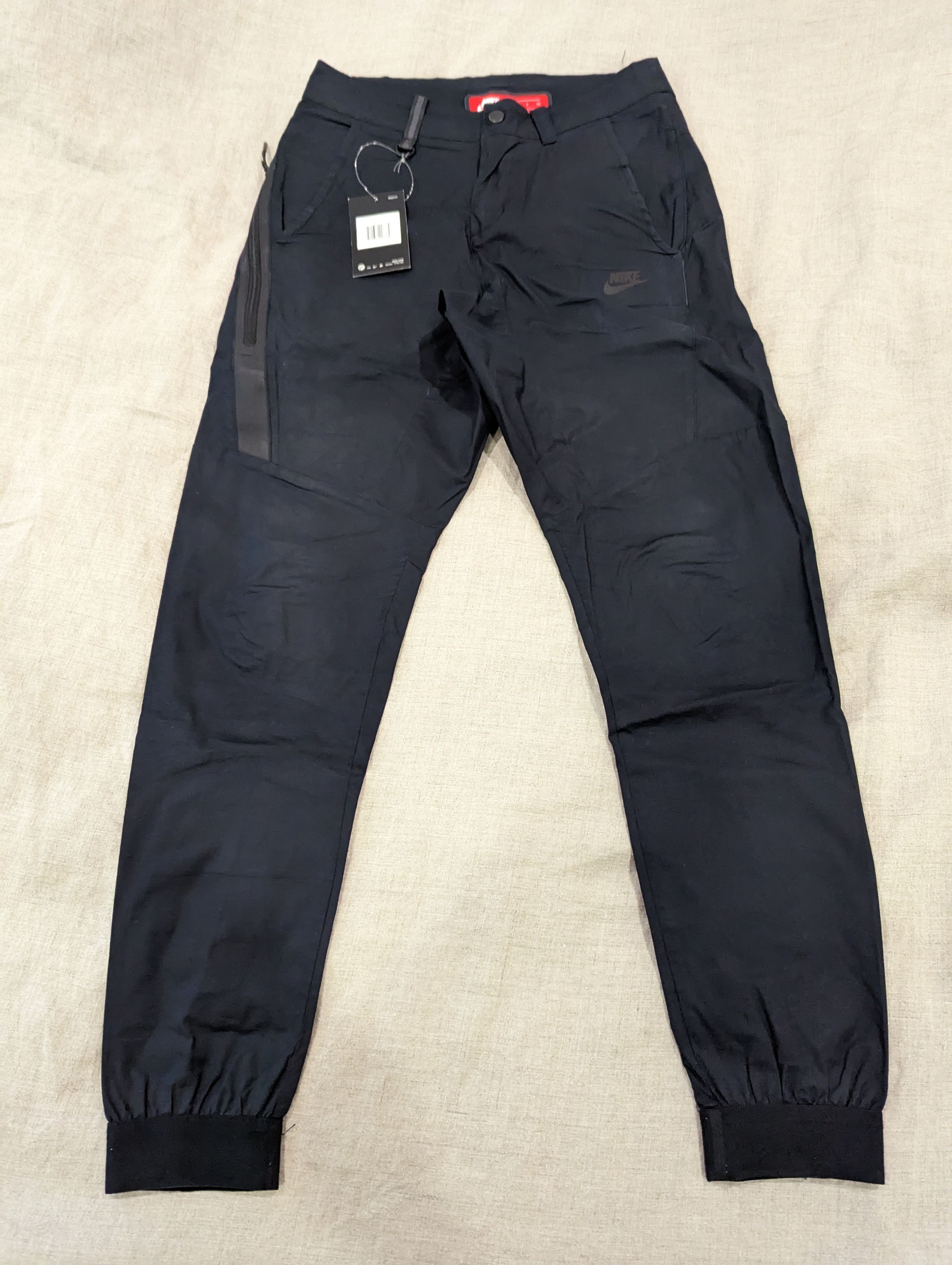 Nike tech woven bonded pants hotsell