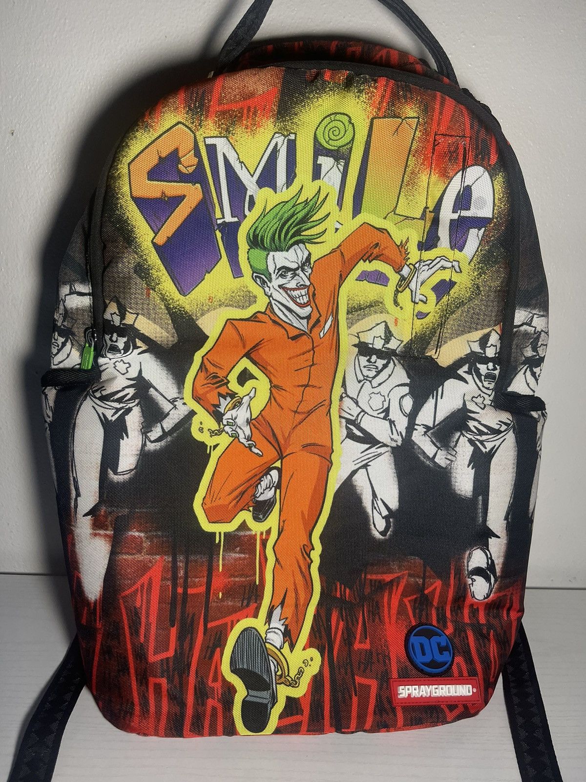 DC Comics × Sprayground Sprayground The Joker: Can't Catch Me Backpack ...