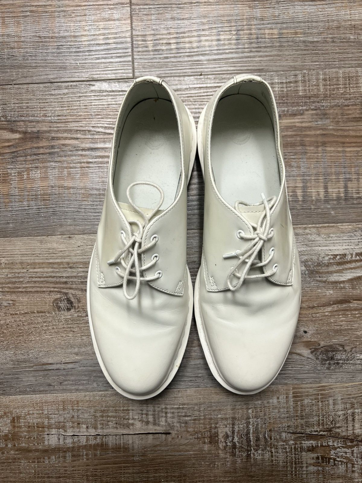 all white leather dr. martens oxfords