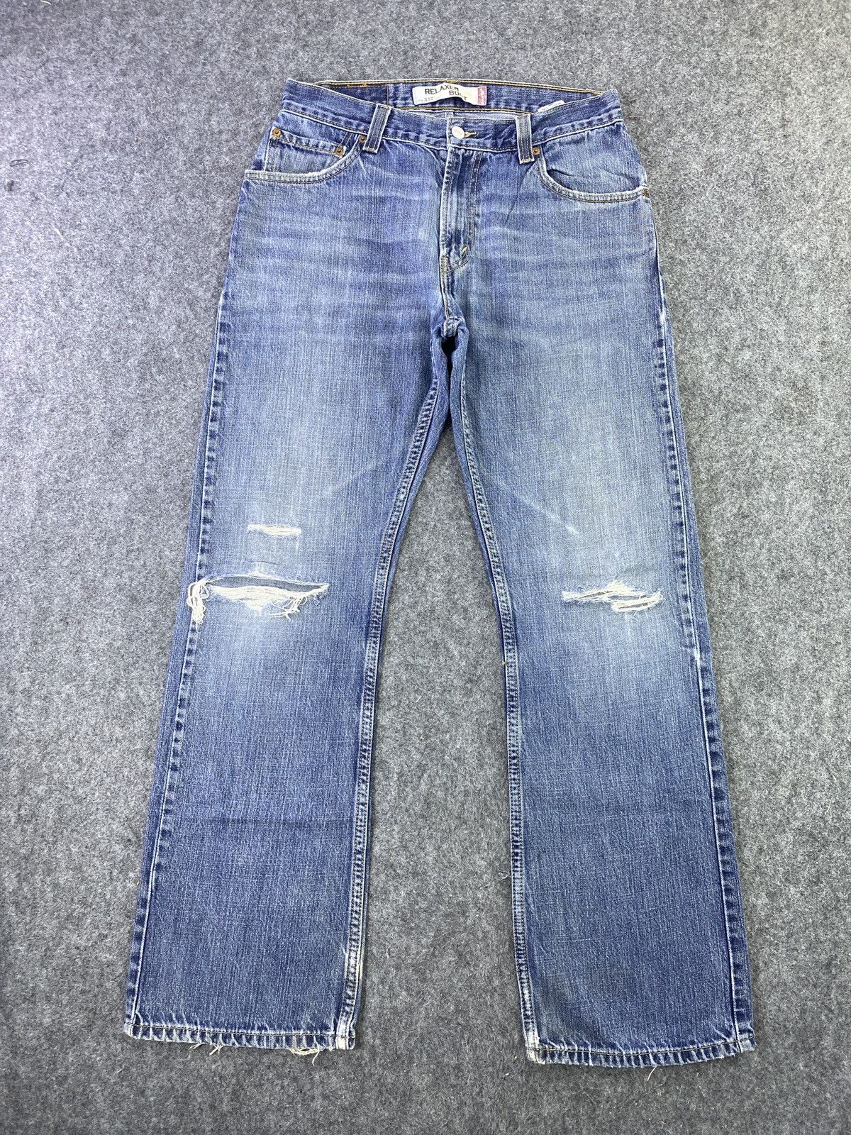 VINTAGE LEVIS 557 DISTRESS BLUE WASH JEANS - J612