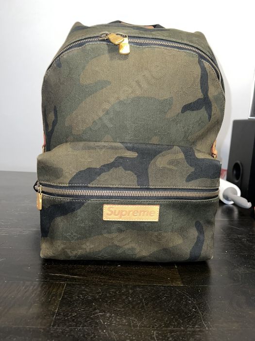 Supreme lv hot sale camo backpack