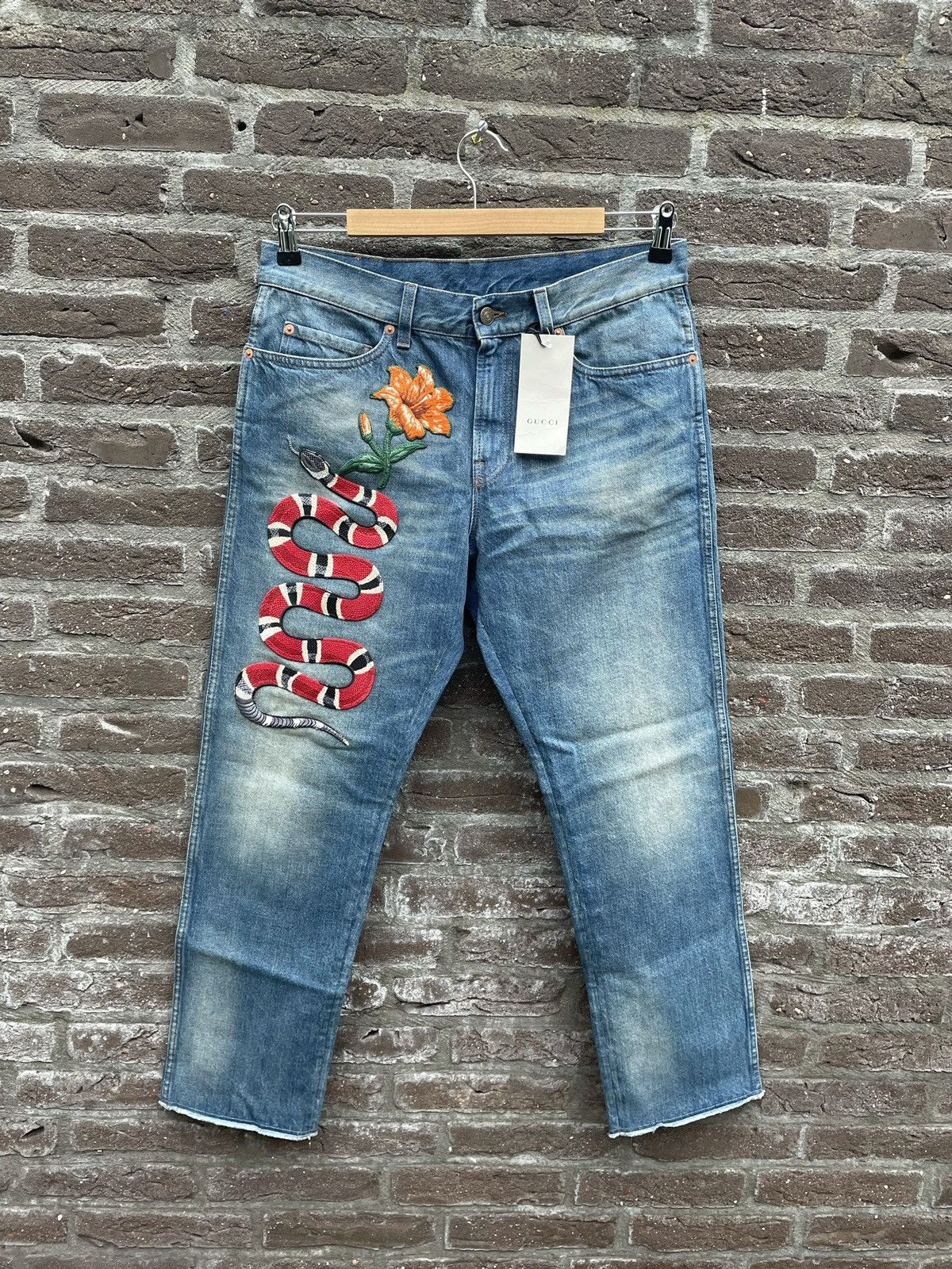 Gucci snake jeans mens online