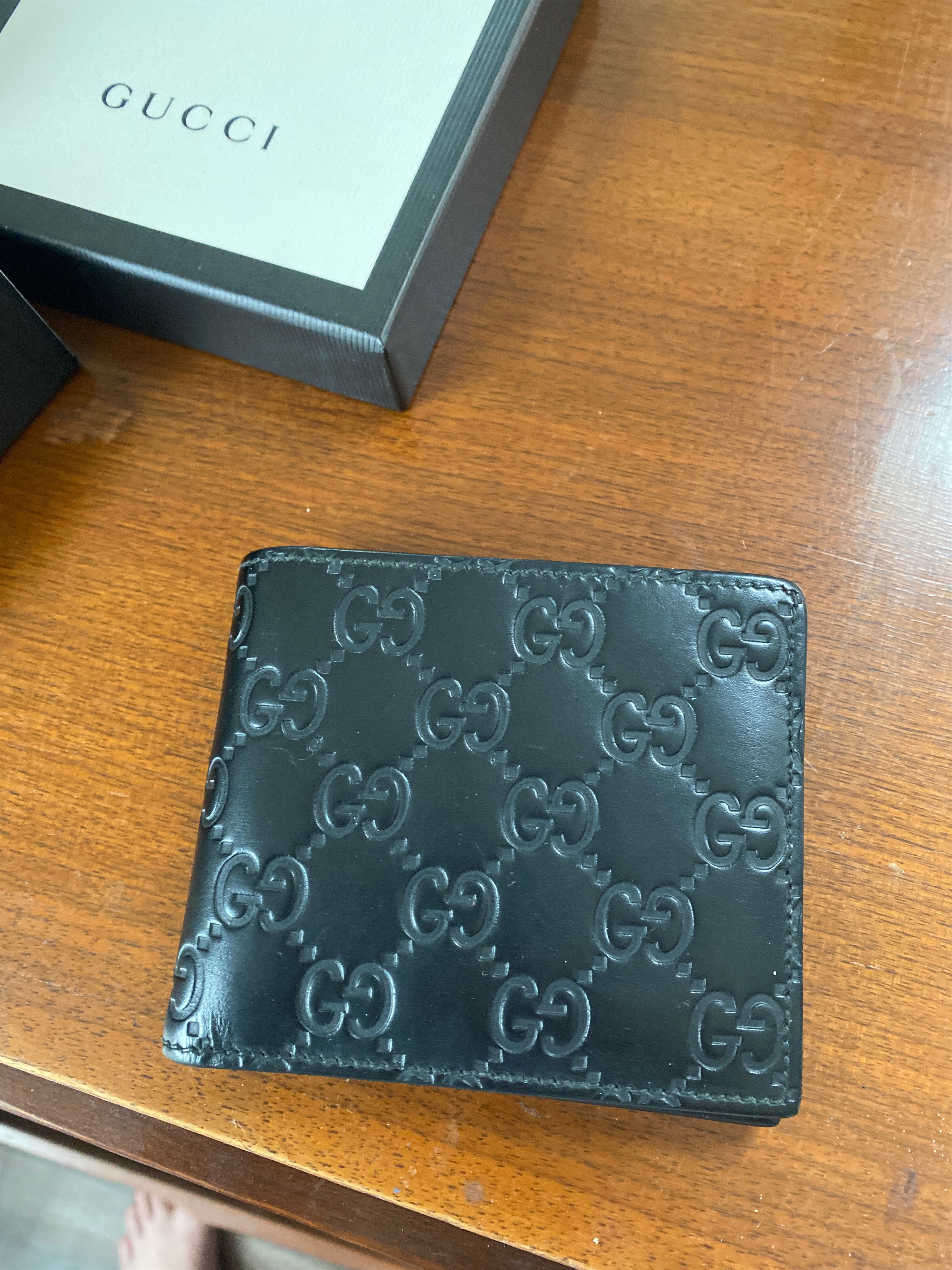 image of Gucci Leather Signature Monogram Bifold Wallet in Black, Men's