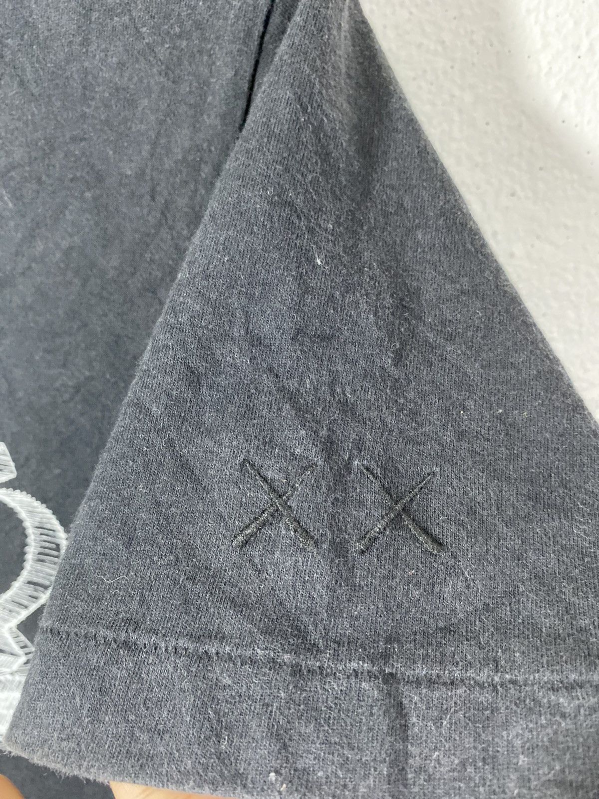 Kaws × Uniqlo kaws x uniqlo spell out Size US M / EU 48-50 / 2 - 7 Thumbnail