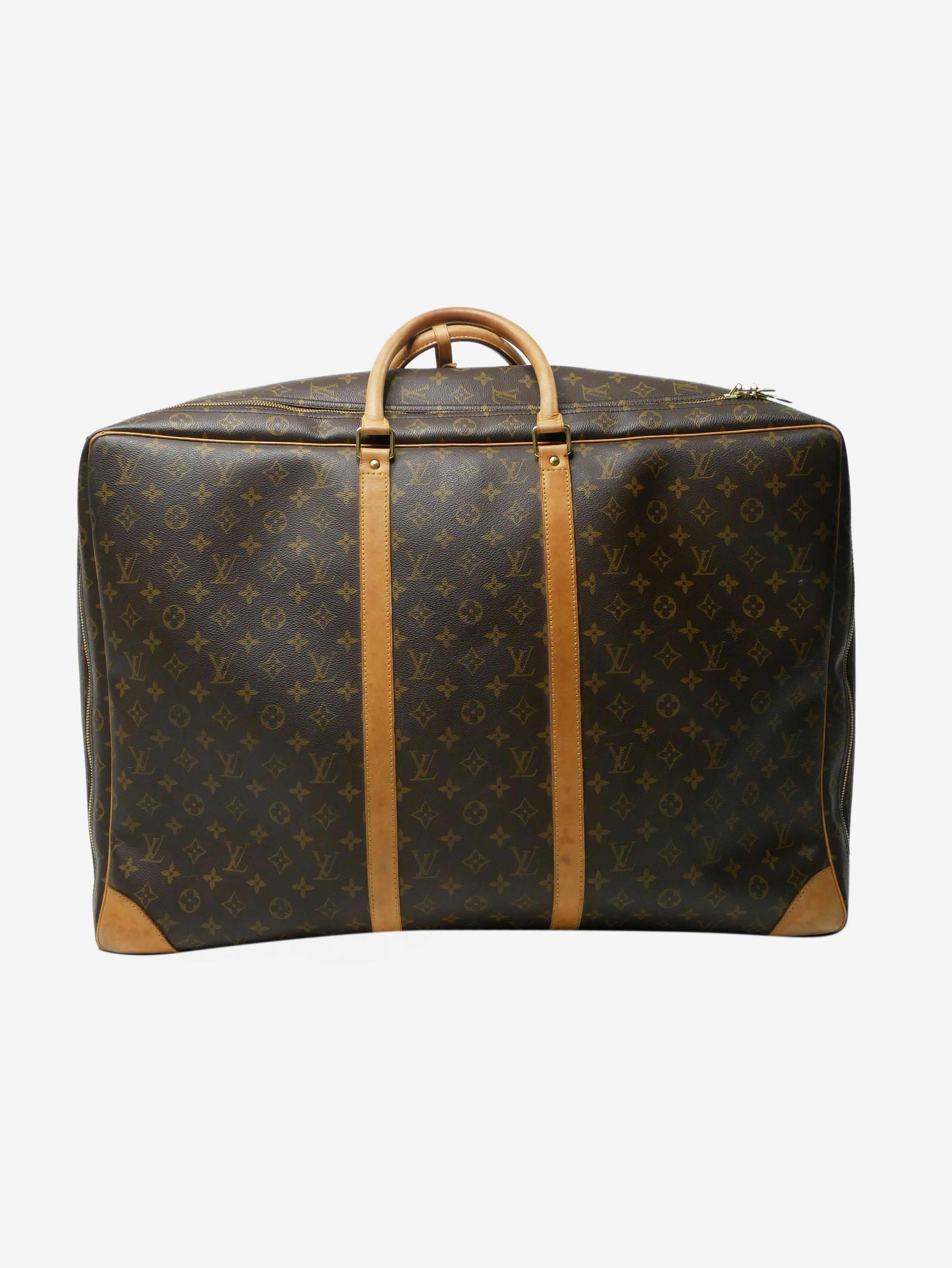 Brown 99 monogram suitcase