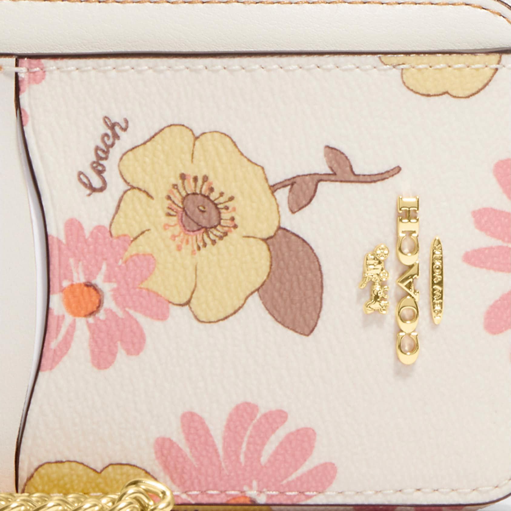 New with tags attached selling a COACH zipped card case in flowered pattern