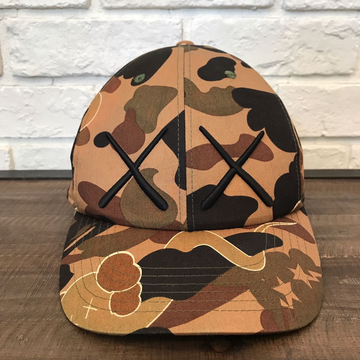 Kaws bape hat best sale