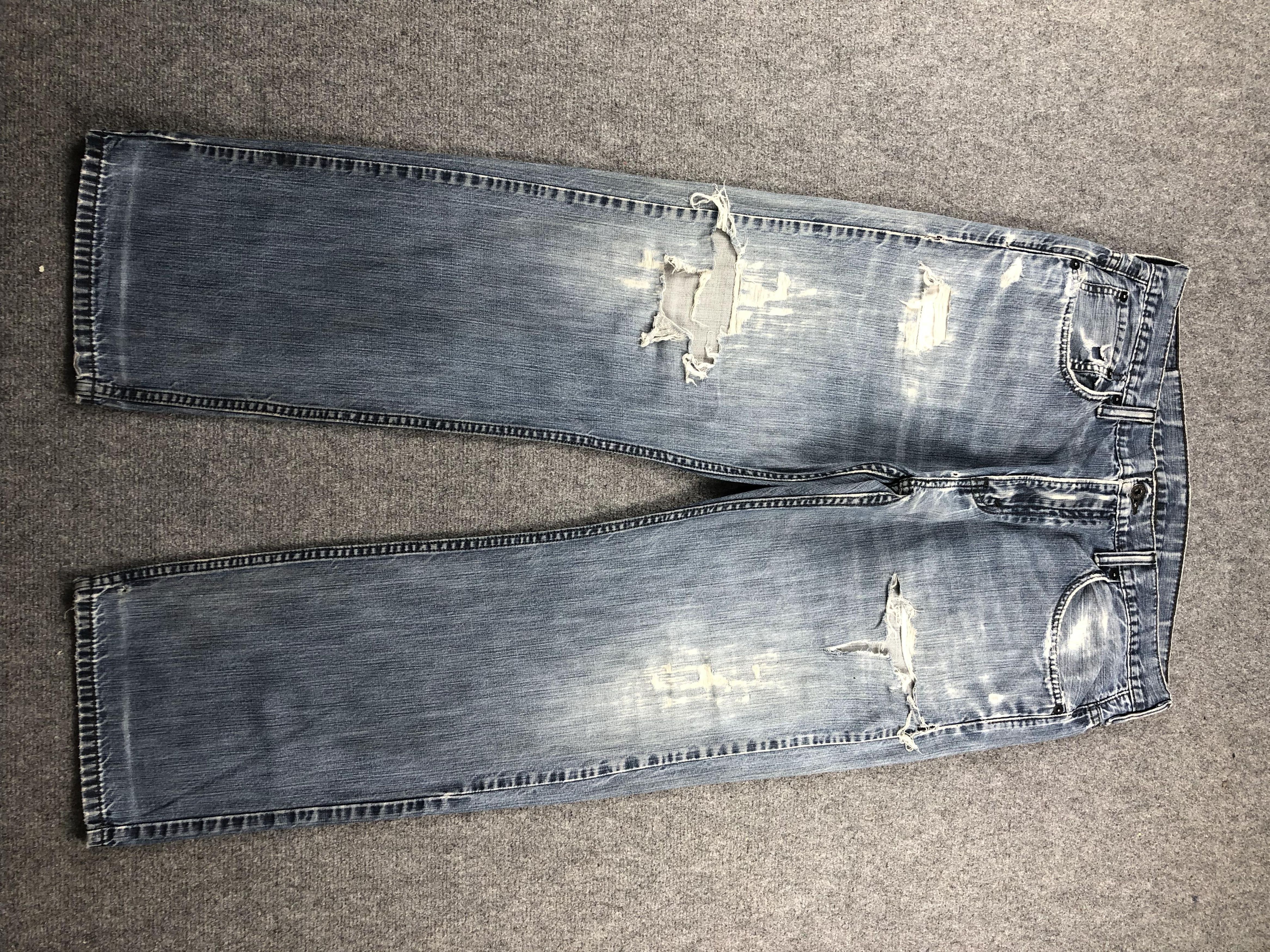 image of Distressed Levis 569 Baggy Faded Blue Jeans in Blue Denim, Men's (Size 36)