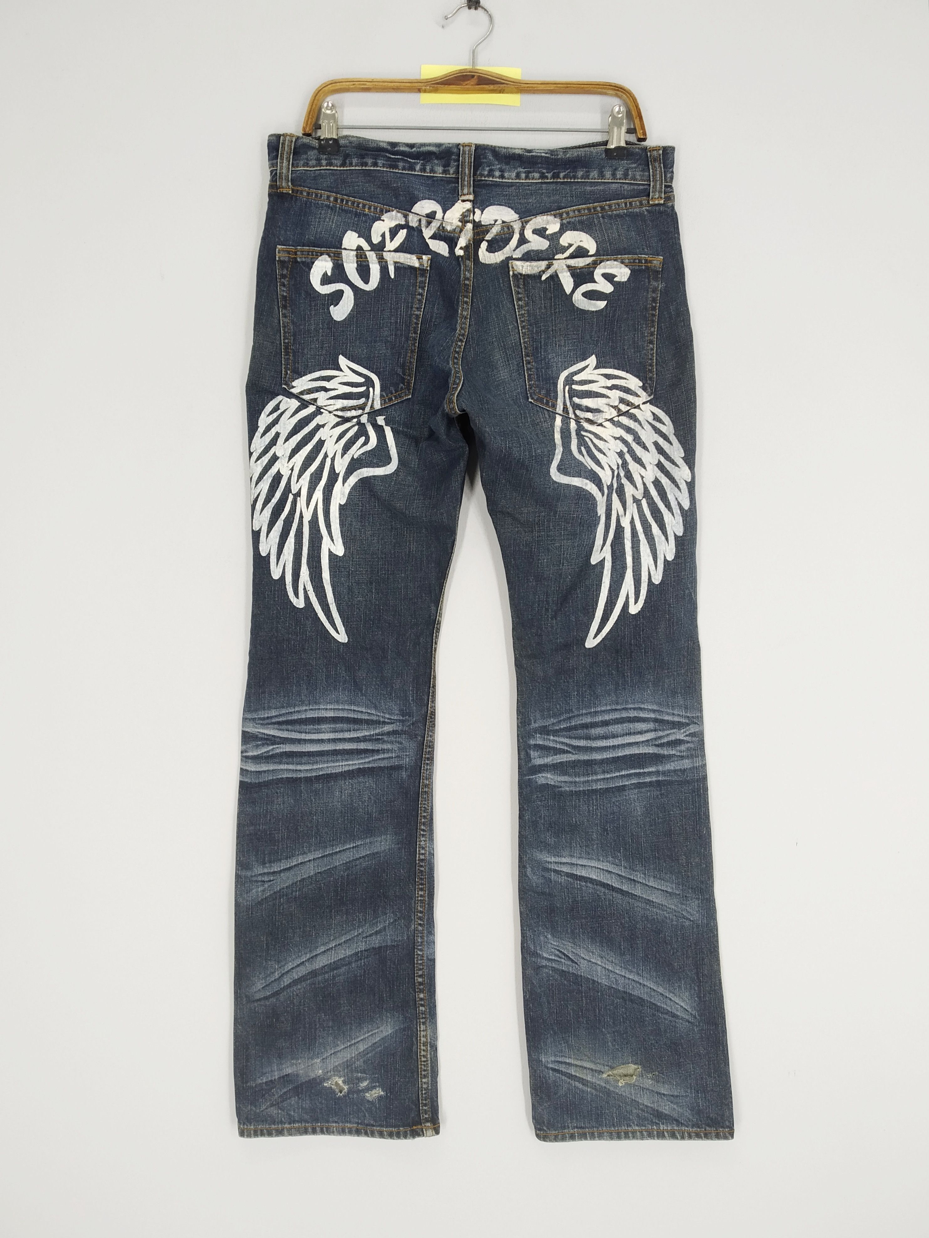 image of Distressed Denim Vintage Sorridere Wings Pattern Stonewash Blue Ripped Jeans in Dark Blue (Size 35)