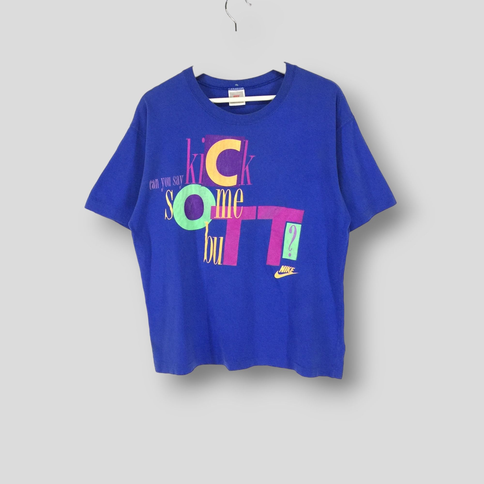 Vintage 90s nike kick some butt spellout tshirt