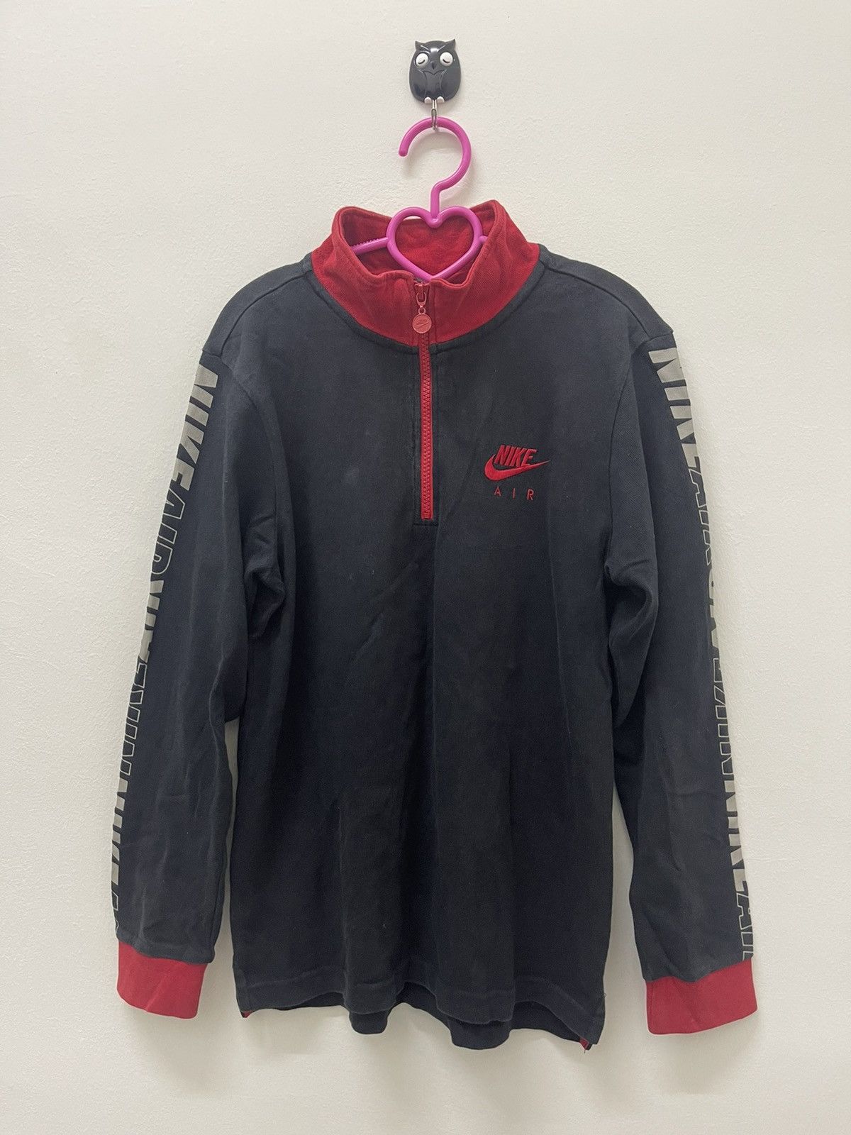 image of Nike Spell Out Side Taped Half Zip Sweater in Black, Men's (Size Small)