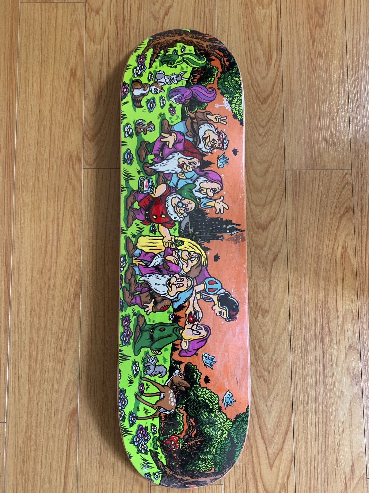 image of Strangelove Skateboards x Todd Bratrud Strangelove Todd Bratrud Snow White Apple Skateboard Deck in