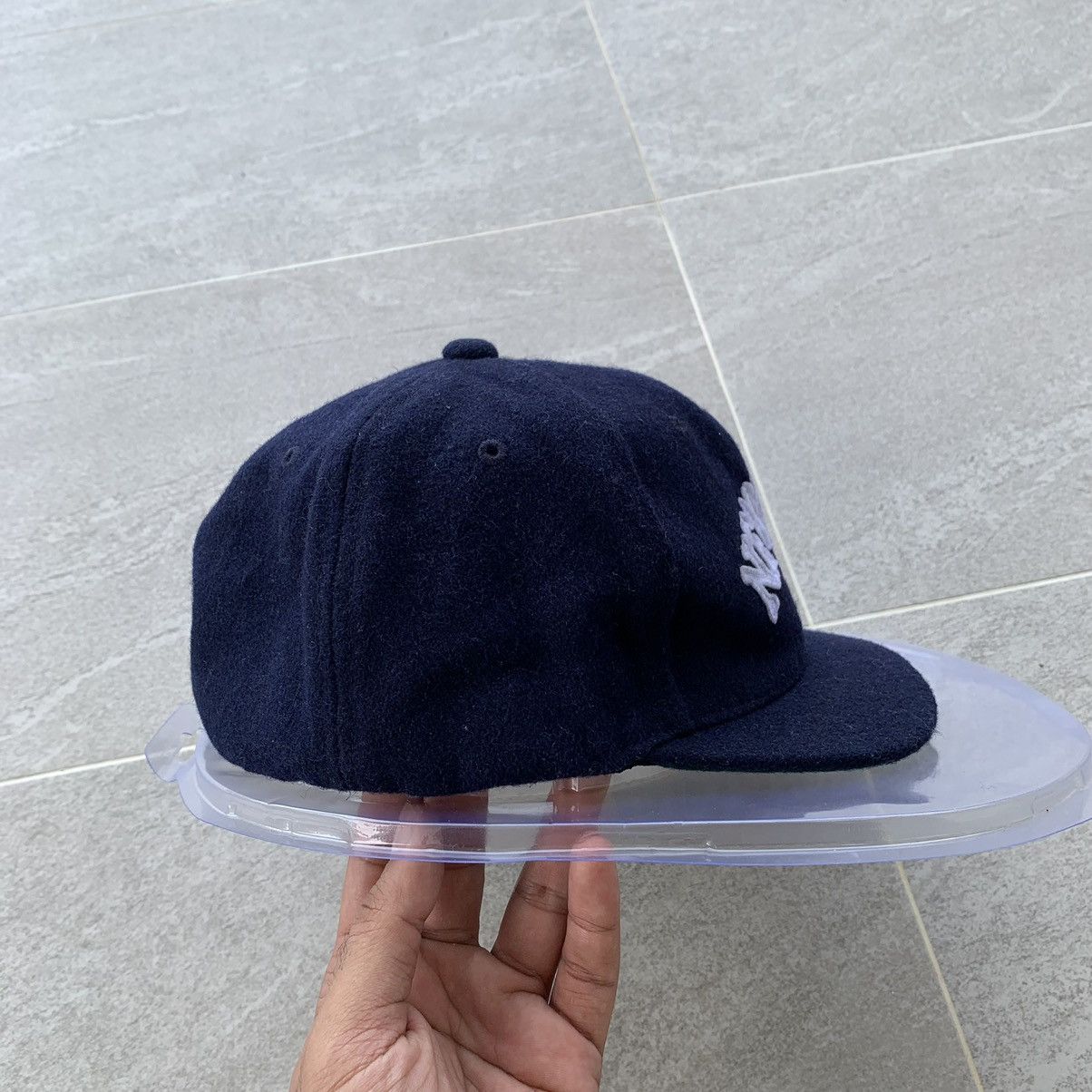 BLUE cap spell out new york logo.. wool material..