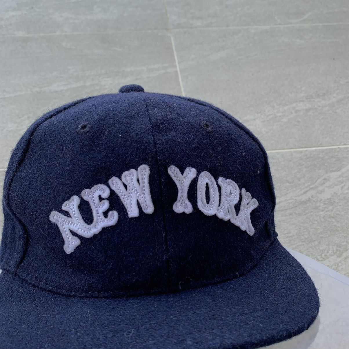 BLUE cap spell out new york logo.. wool material..