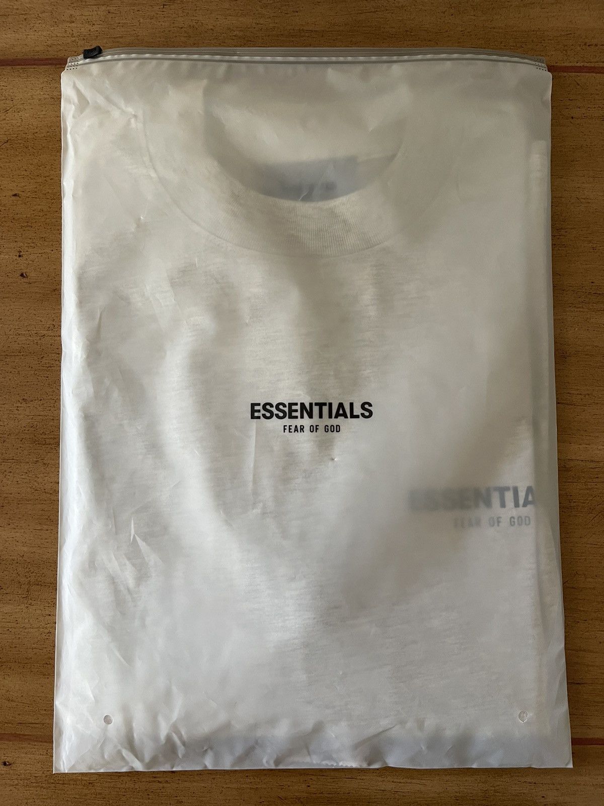 FOG × Fear of God × Pacsun FEAR OF GOD ESSENTIALS Logo-Print Long Sleeve T-Shirt Sz (L) Size US L / EU 52-54 / 3 - 5 Thumbnail