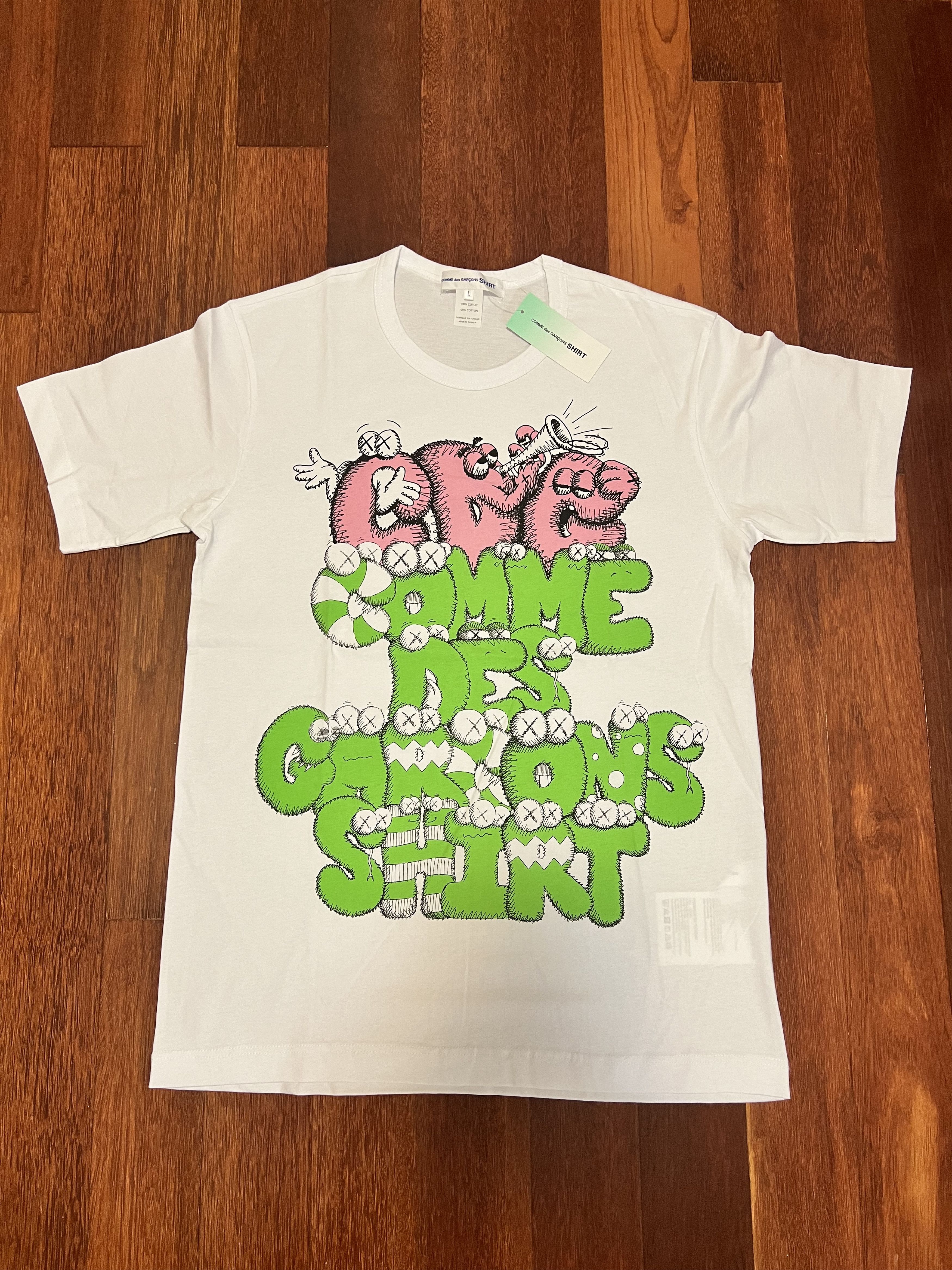 Comme des Garcons SHIRT × Kaws 💚 Comme des Garçons CDG Shirt x KAWS White Tee Large NEW Size US L / EU 52-54 / 3 - 1 Thumbnail
