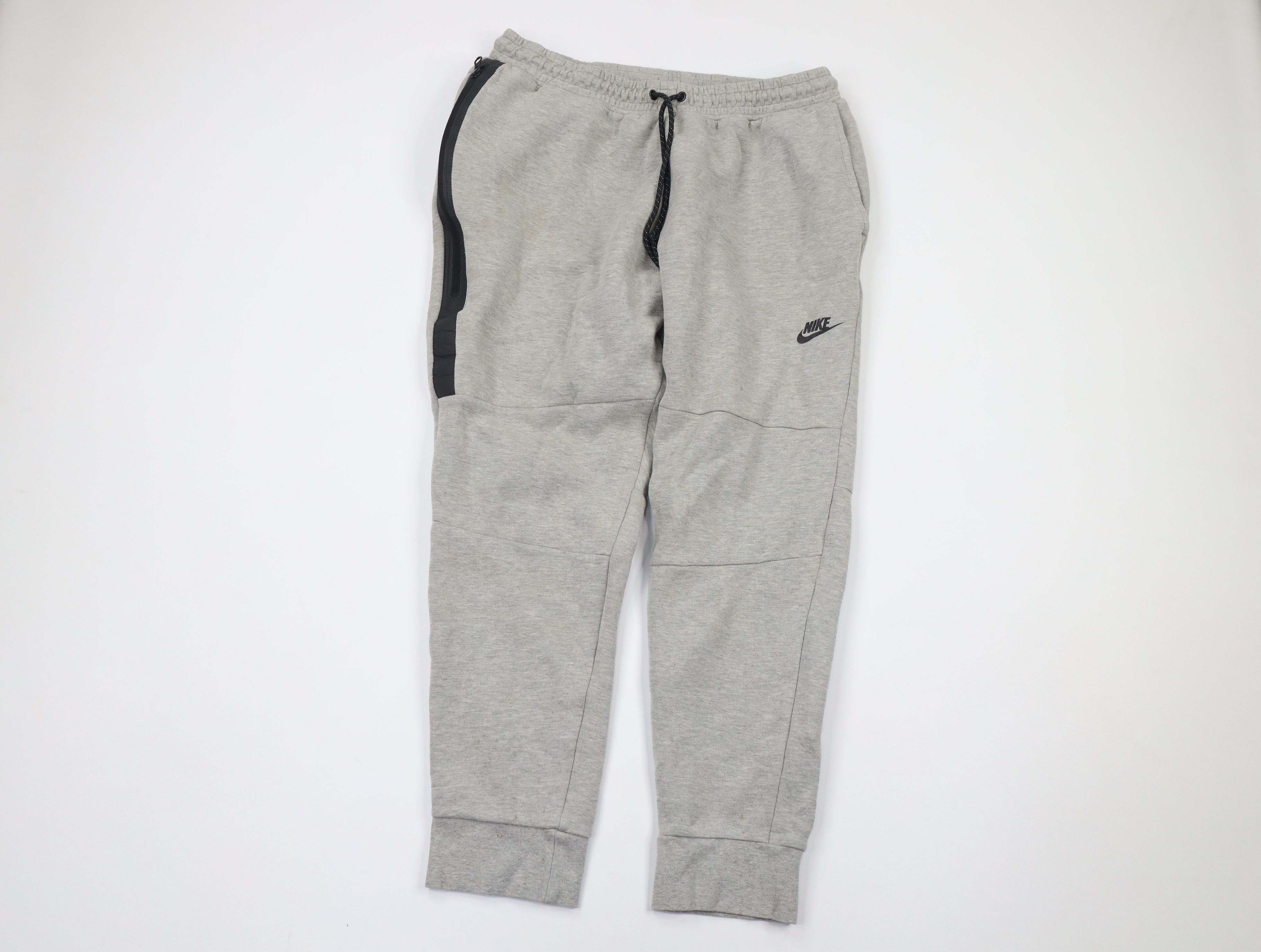 Image of Nike Sportswear Spell Out Tech Fleece Joggers Jogger Pants in Grey, Men's (Size 38)