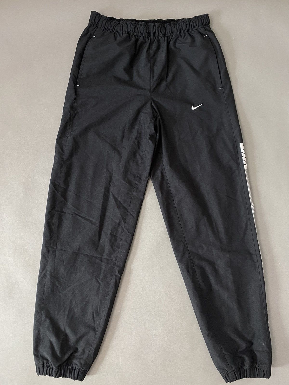 Nike × Vintage Nike vintage black track pants small swoosh spell out Size US 32 / EU 48 - 1 Thumbnail