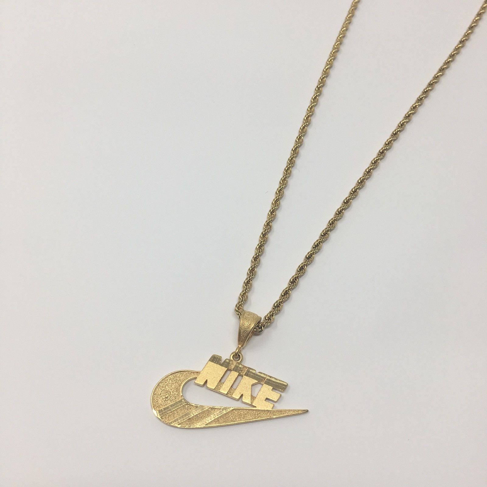 Nike Swoosh Logo Pendant with 18 Figaro Chain in 14k Yellow Gold