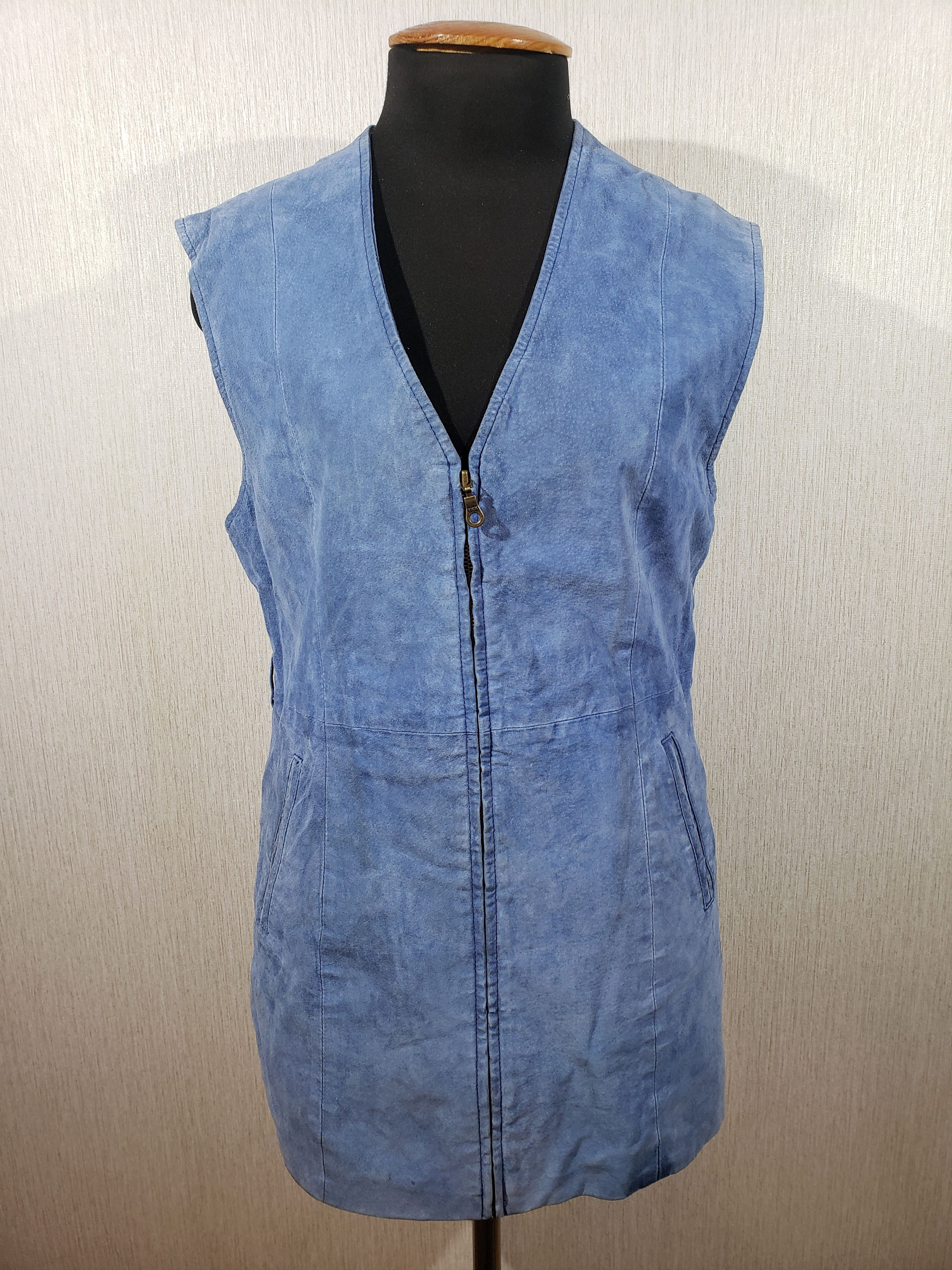 Blue suede women's vest with pockets.