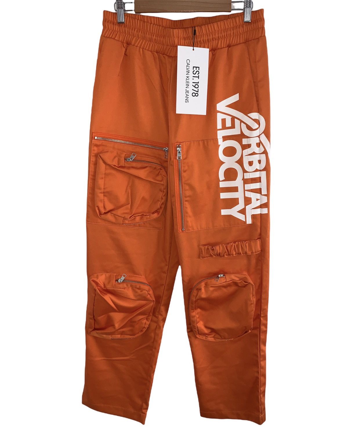 image of Calvin Klein Est Lunar Ascent Work Pants By Raf Simons in Orange, Men's (Size 32)