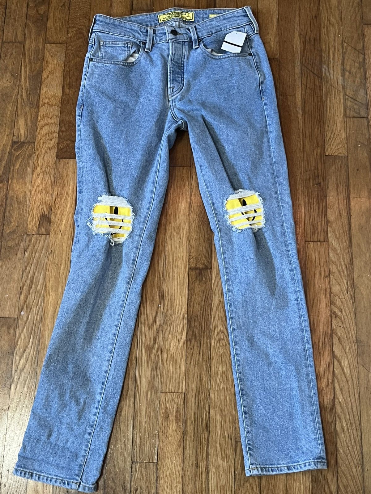 Guess smiley face jeans hotsell