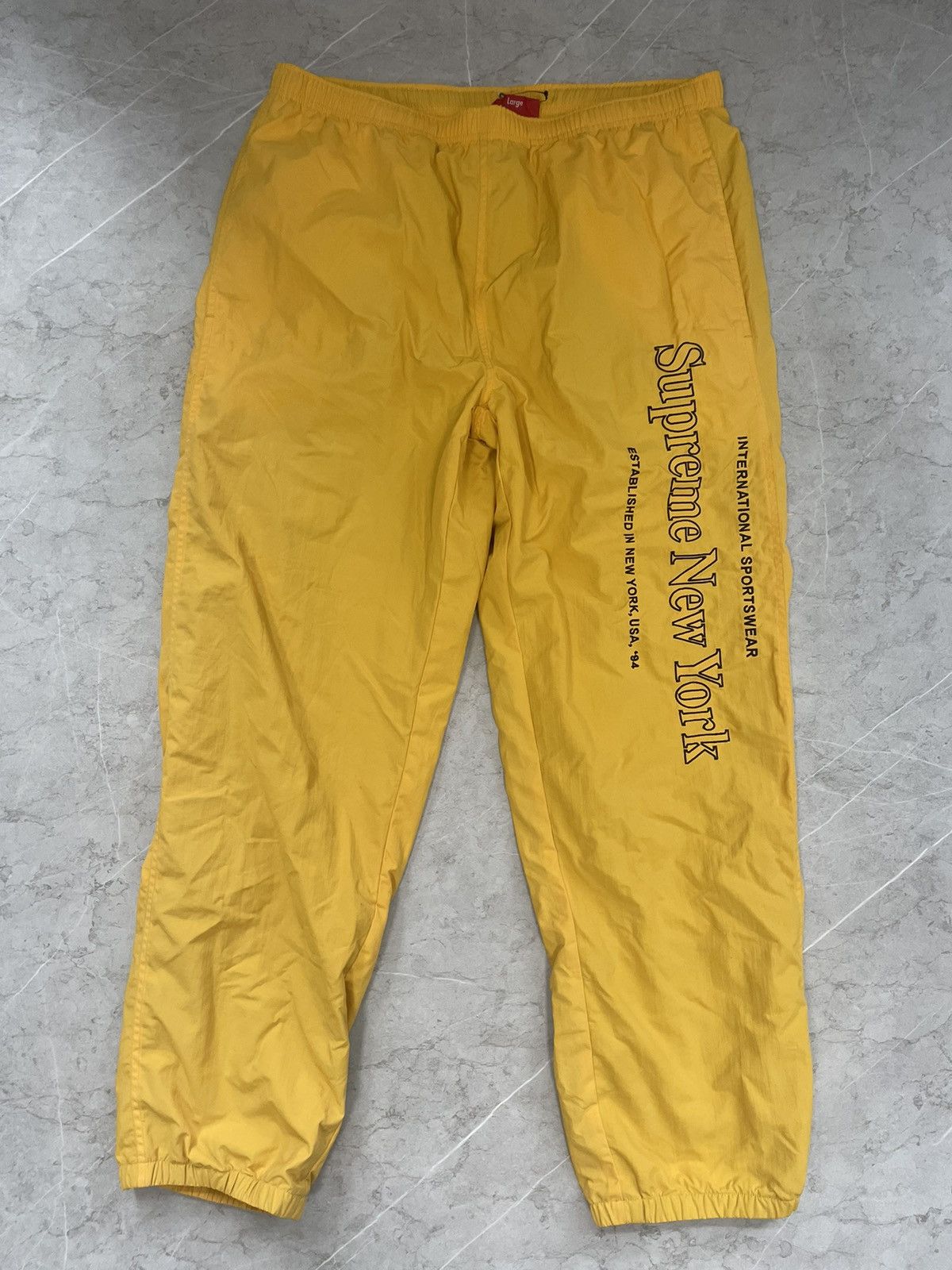 Supreme Side logo track pants | Grailed