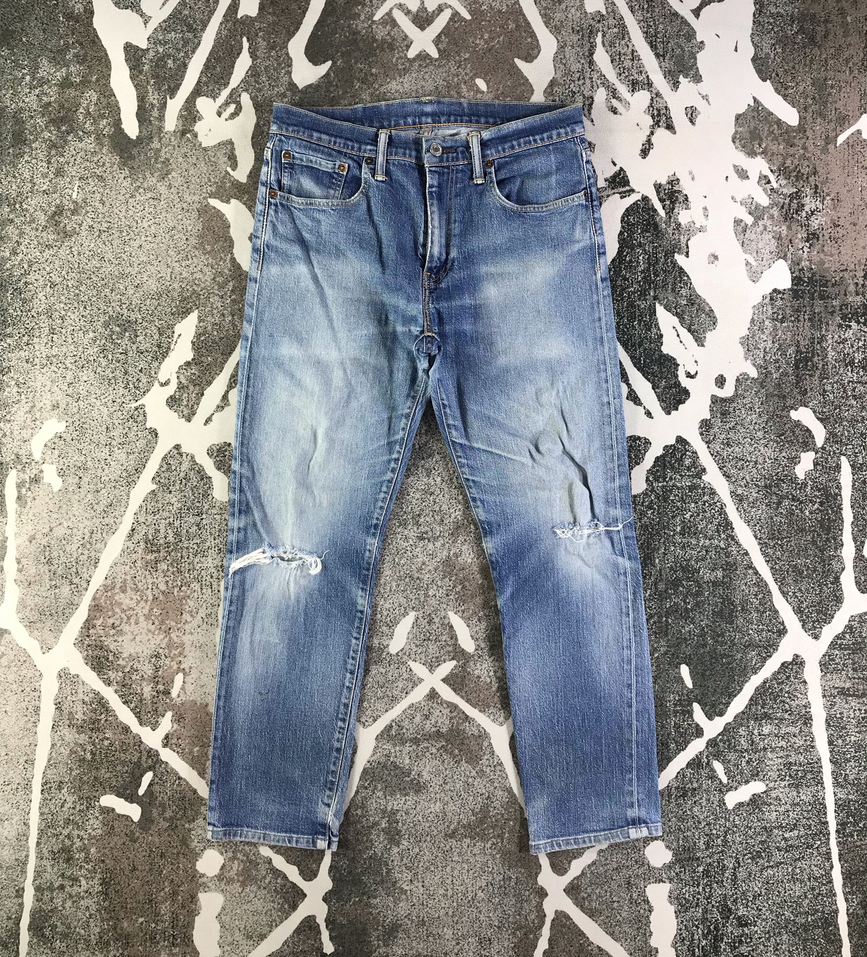 Distress Levis 502 Jeans Faded Blue