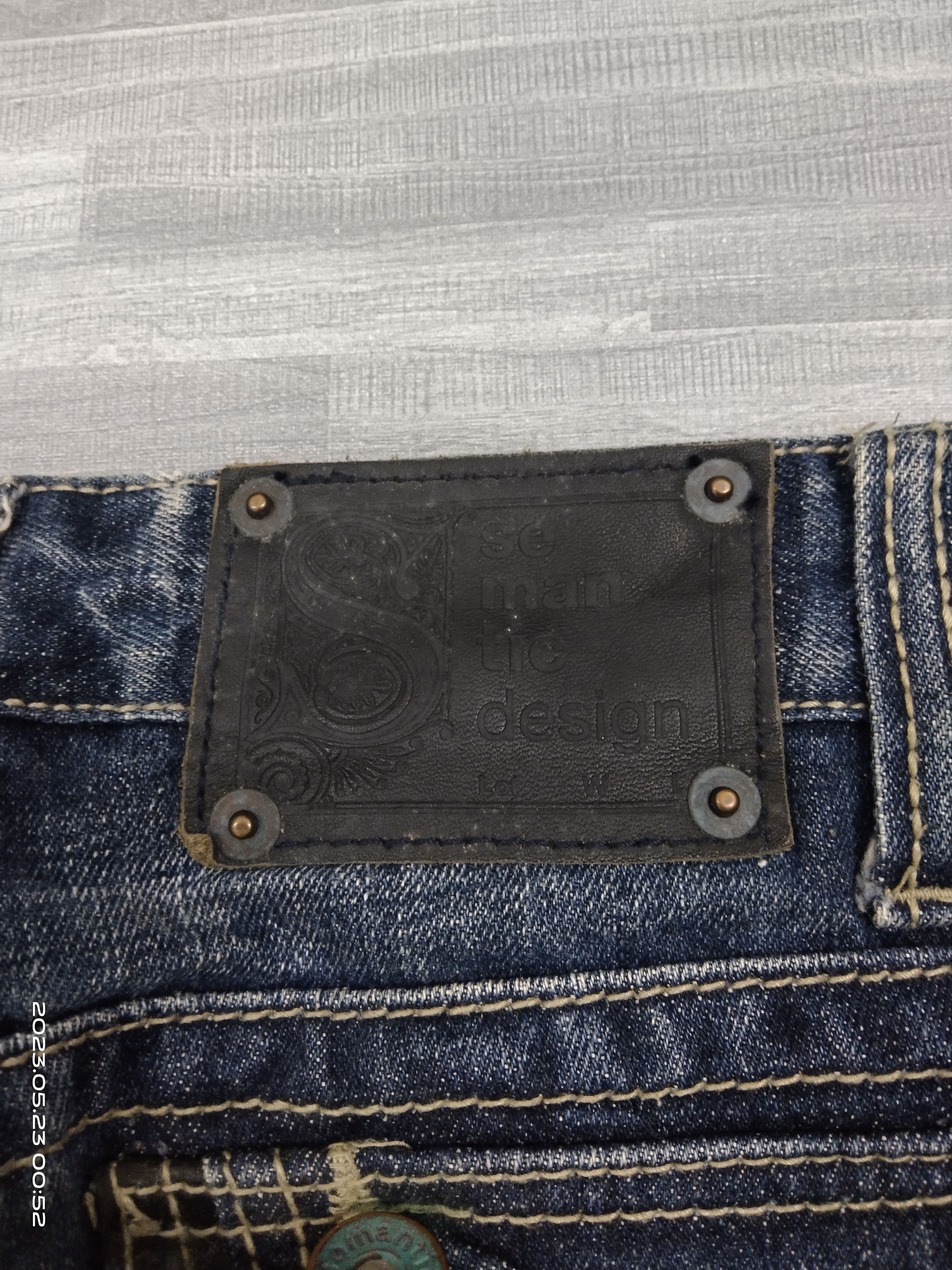 semanticdesign SICK WASHED BLUE SEMANTIC DESIGN STUDDED DENIM PANTS Size US 31 - 11 Thumbnail