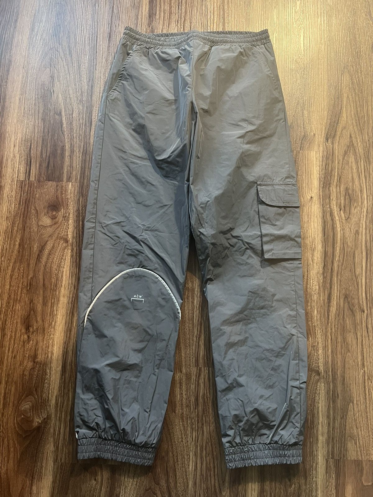 A Cold Wall A Cold Wall ACW* Nylon cargo pants with reflective details ...