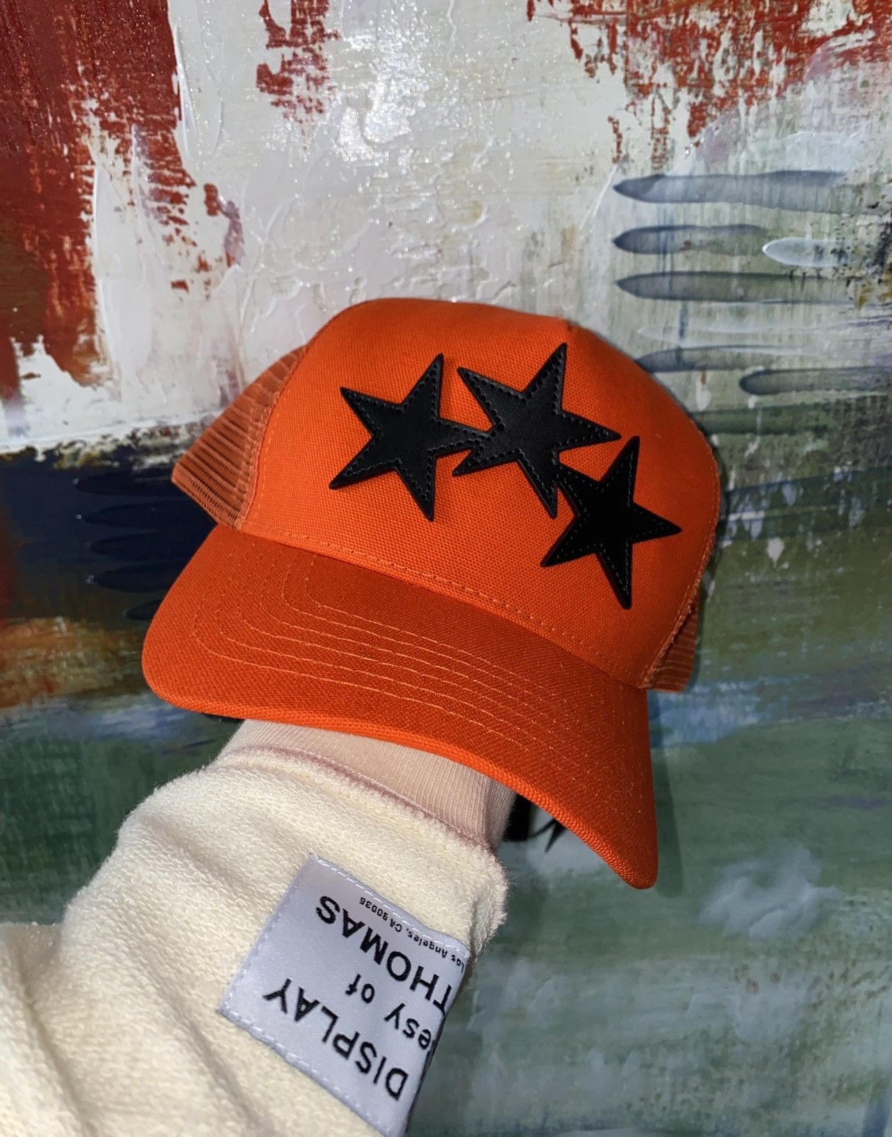 image of Amiri 3 Star Trucker Hat in Orange, Men's