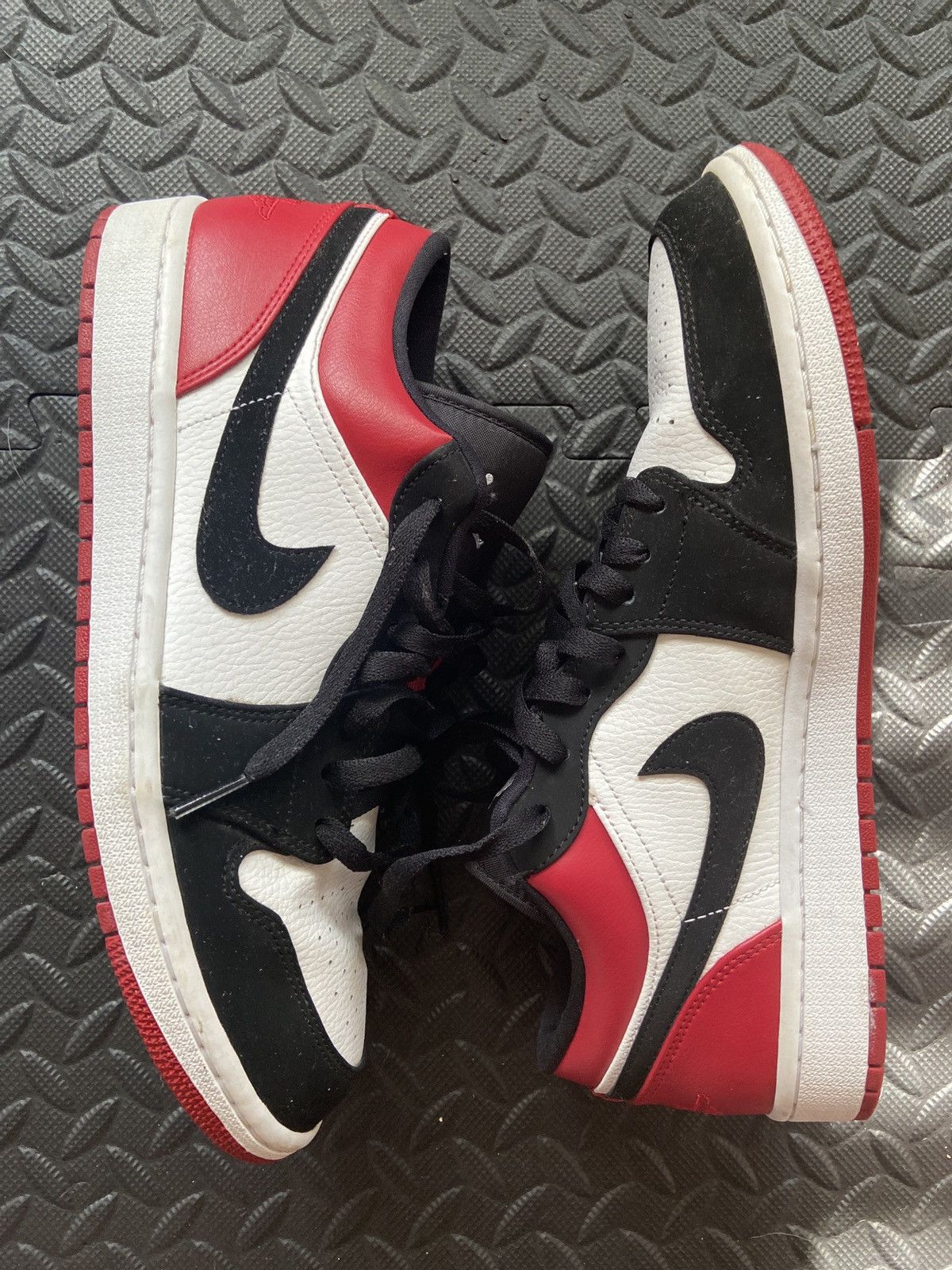 image of Jordan Nike Jordan 1 Low Black Toe Shoes in Red, Men's (Size 11)