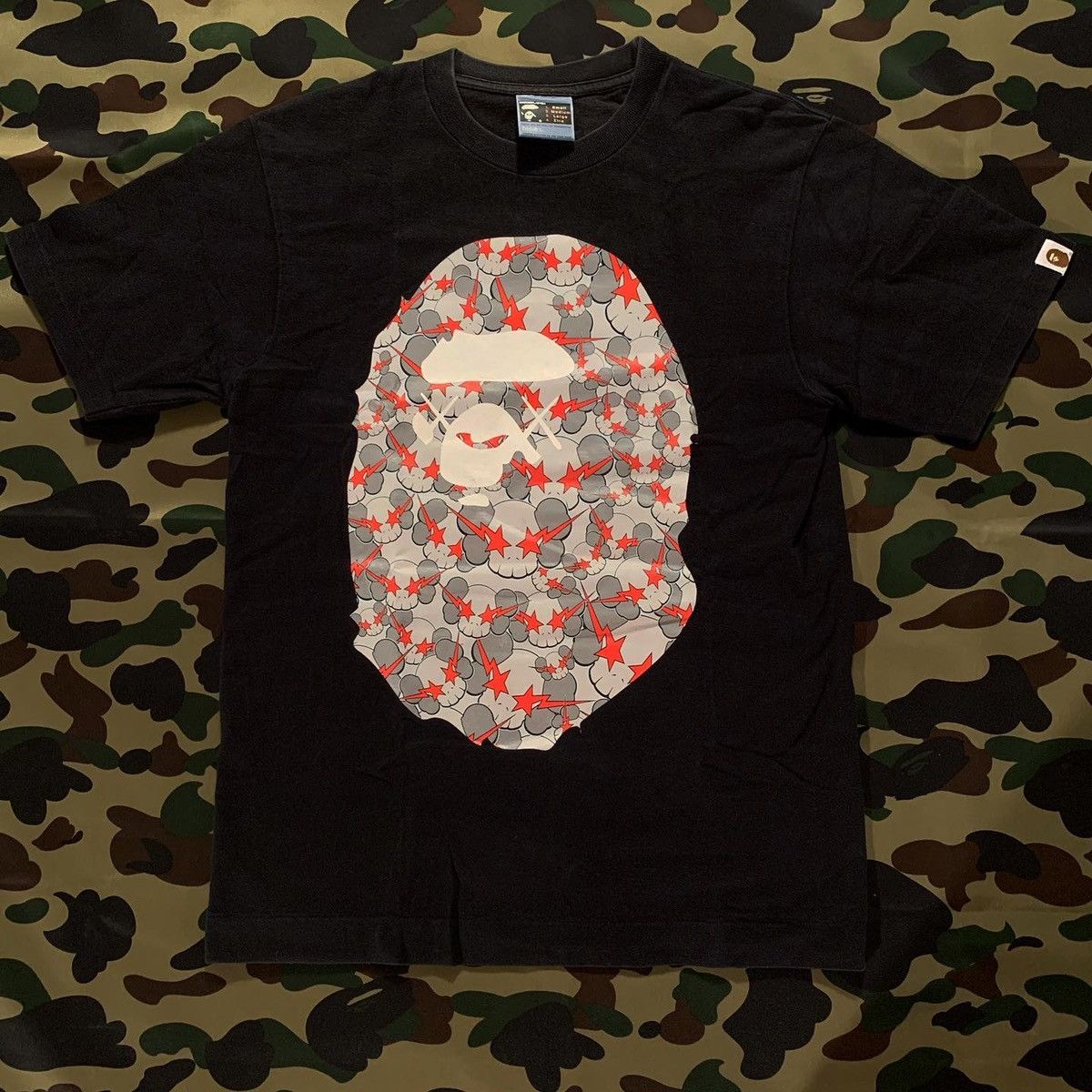 image of Bape x Kaws Skullsta Big Ape Head Tee in Black, Men's (Size Small)