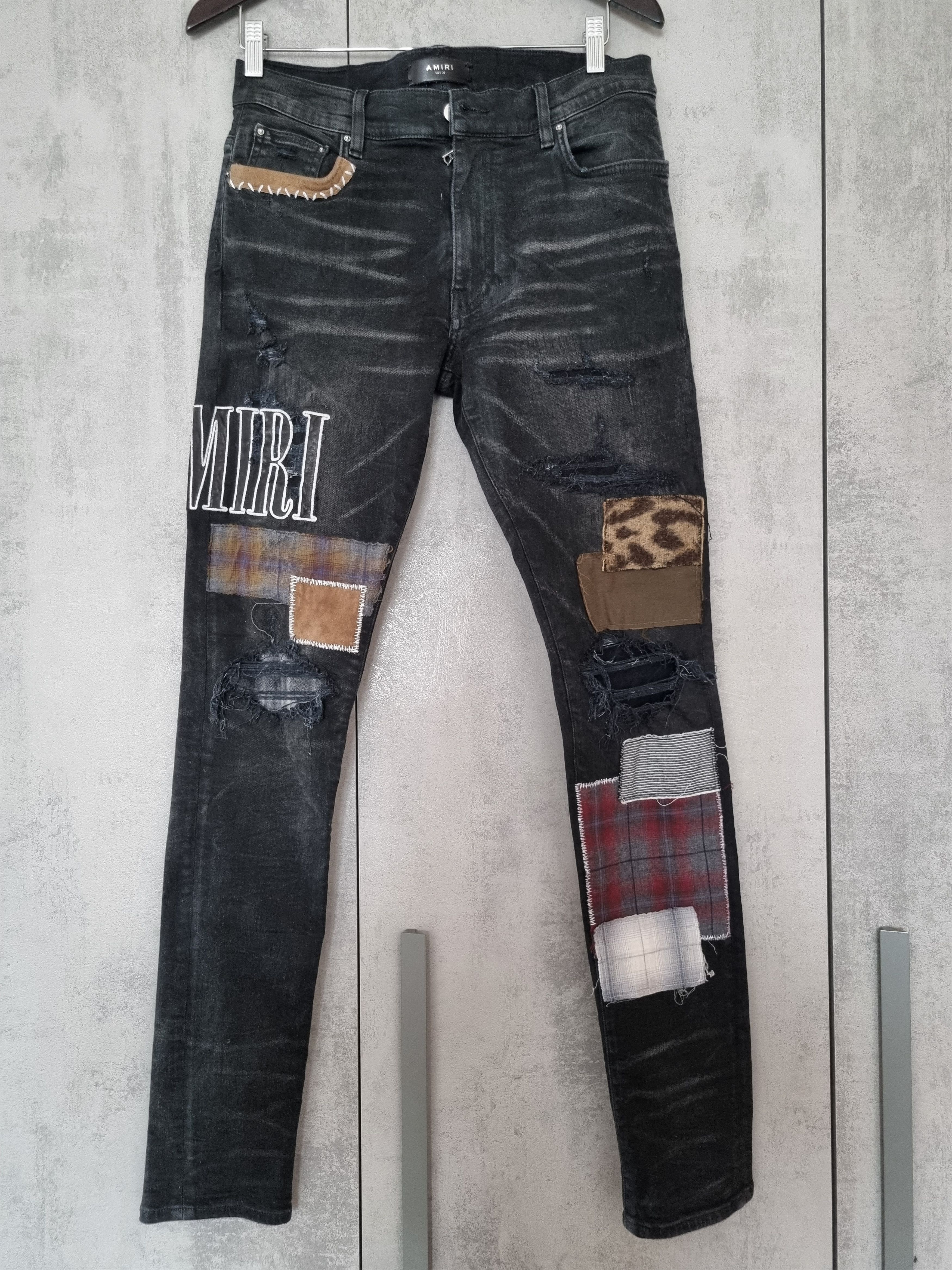 image of Amiri Grunge Patch Jeans in Aged Black, Men's (Size 32)