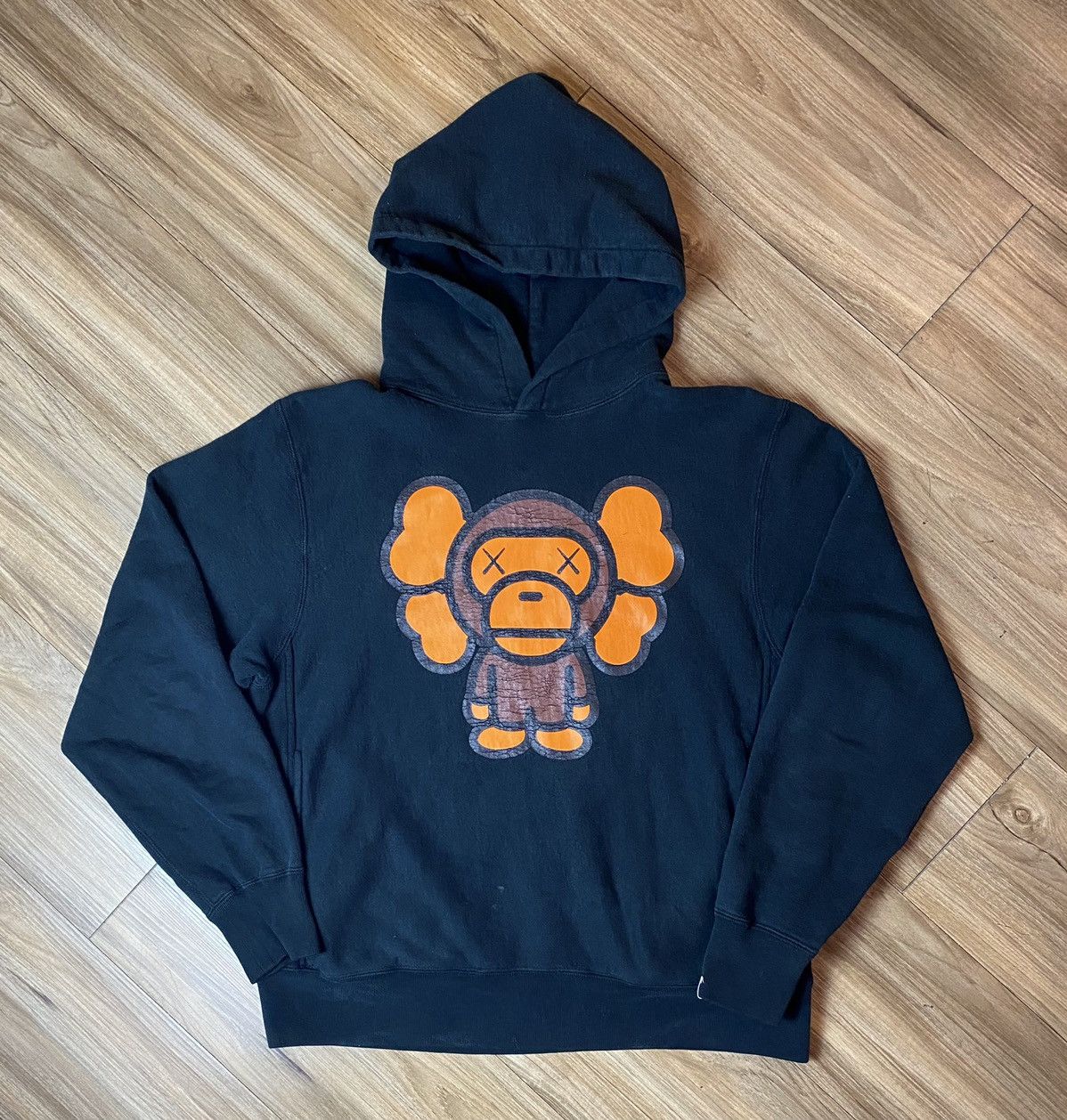 image of Bape x Kaws Baby Milo Pullover Hoodie in Black, Men's (Size Small)