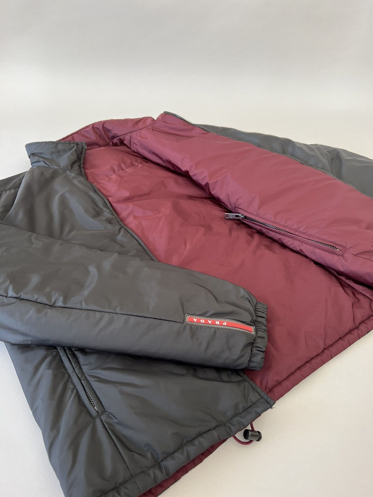 image of Prada Nylon Padded Reversible Jacket in Black/Burgundy, Men's (Size Small)