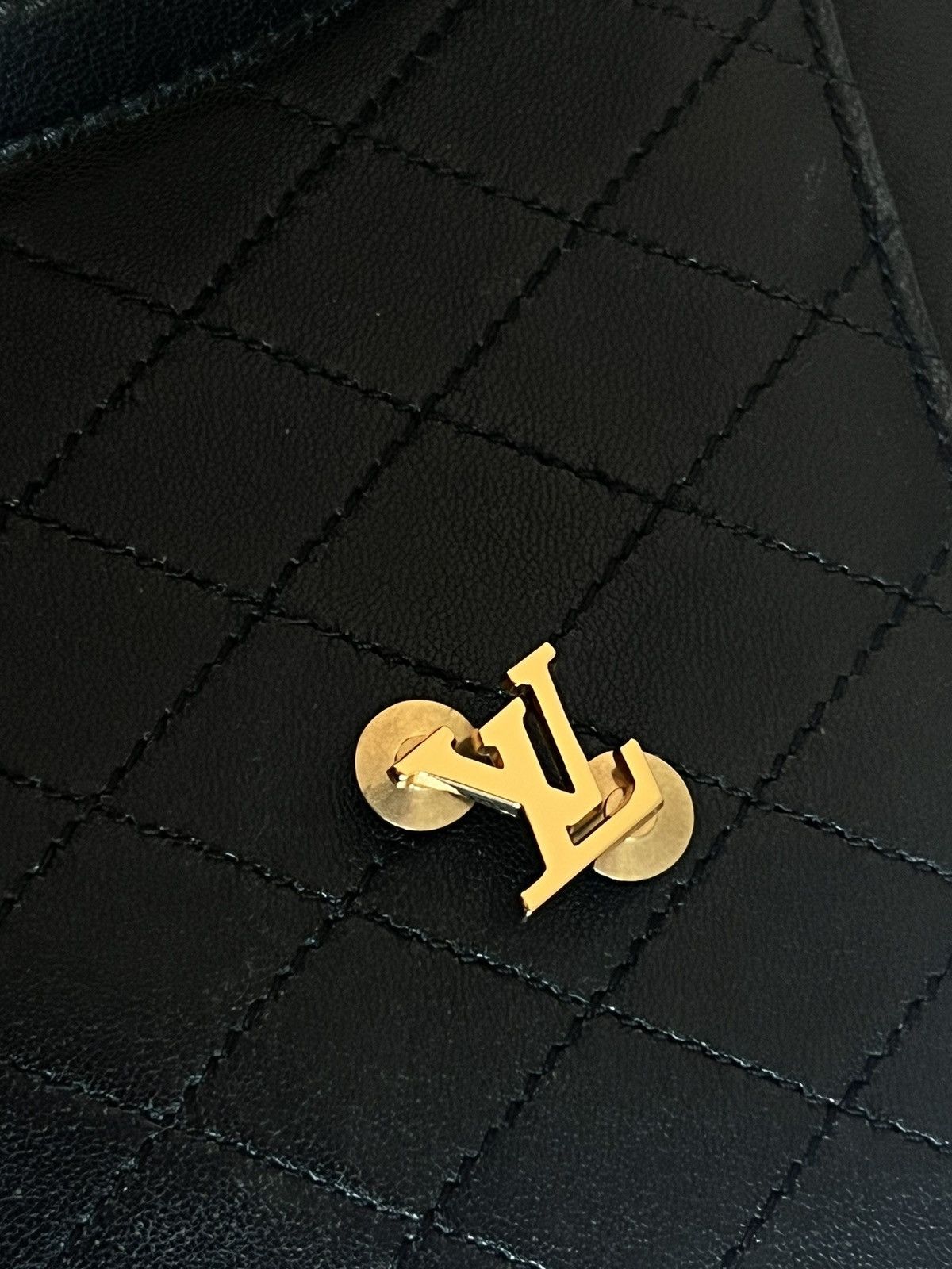 LV gold suit pin