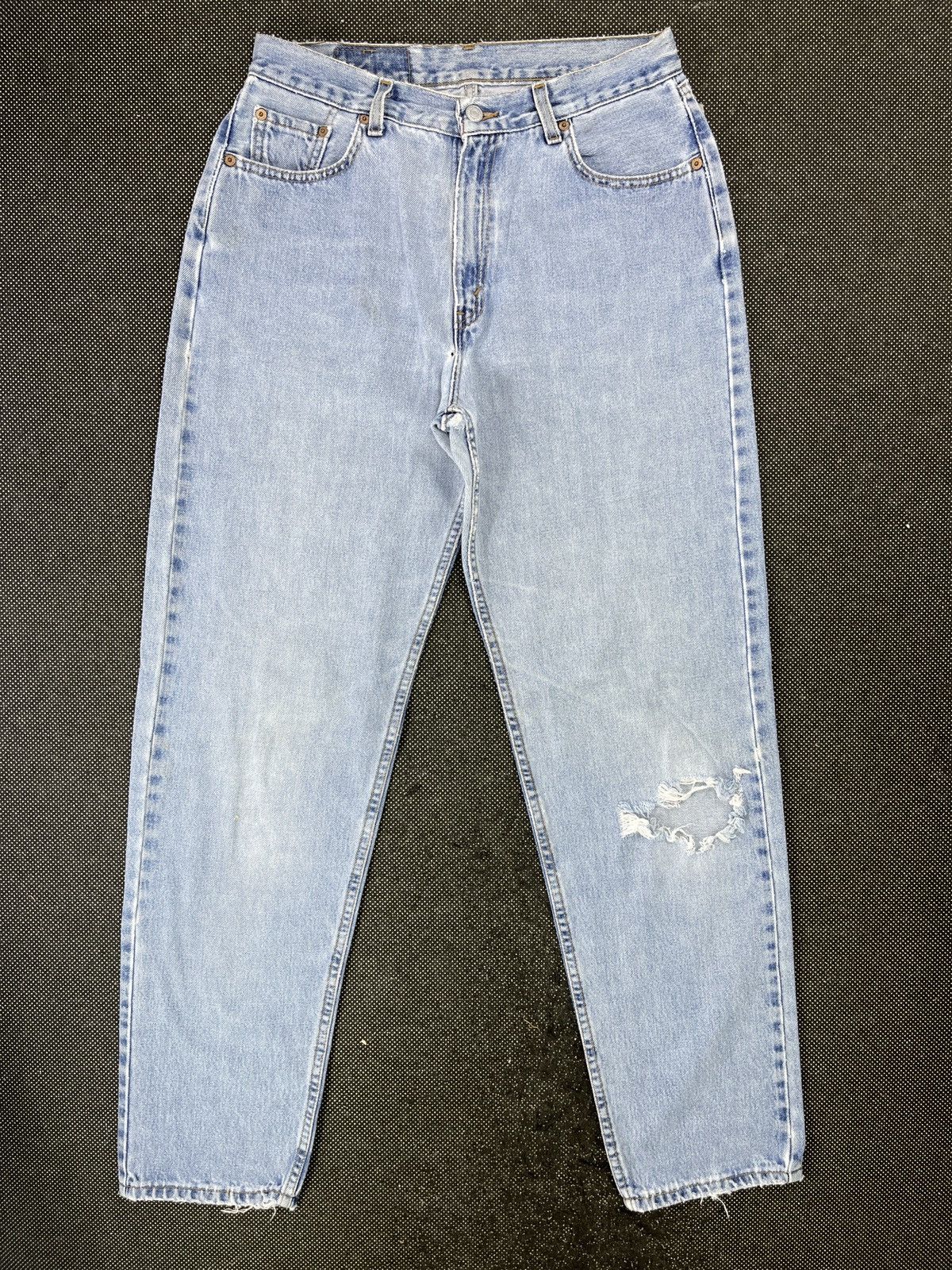 image of 90's Vintage Distressed Levis 560 Light Wash Jeans - J445 in Blue, Men's (Size 32)