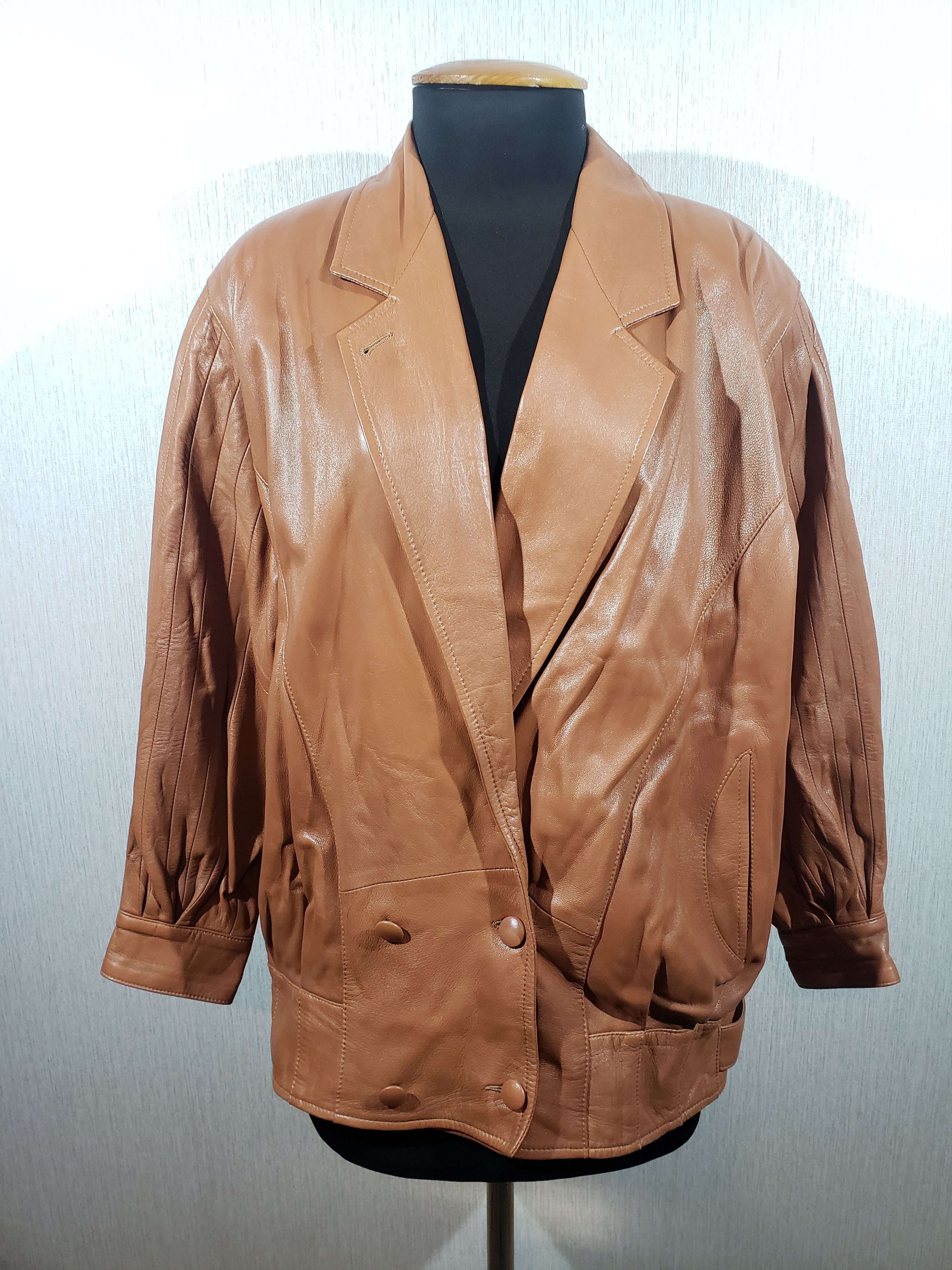 Double-breasted brown leather jacket.