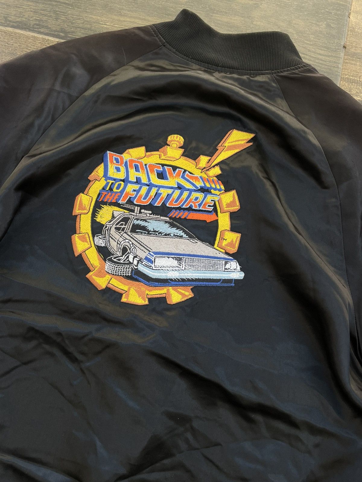 image of 1985 Back To The Future Promo Movie Satin Bomber Jacket in Black, Men's (Size Large)