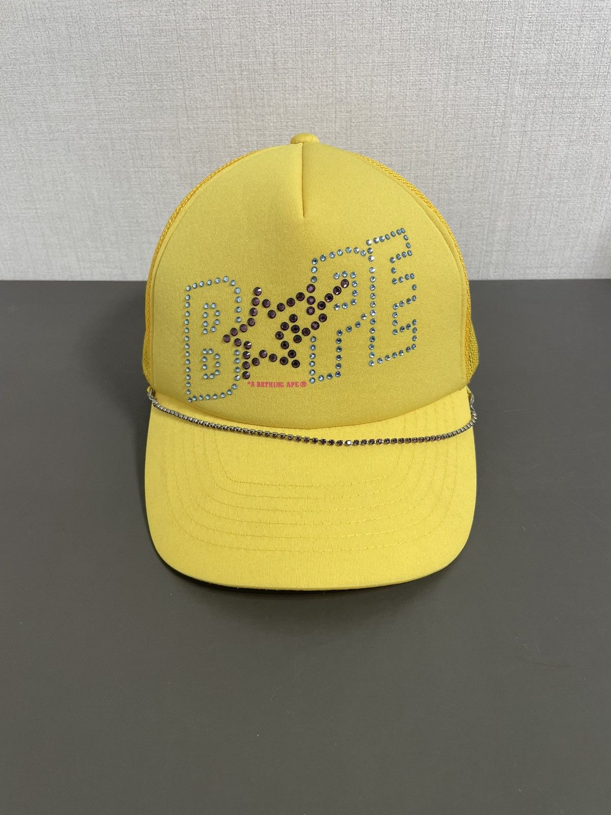 image of Bape Swarovski Trucker Hat in Yellow, Men's