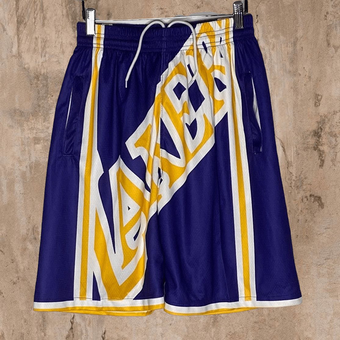 image of Lakers Basketball Shorts Hardwood Classics Front Spellout in Purple, Men's (Size 36)