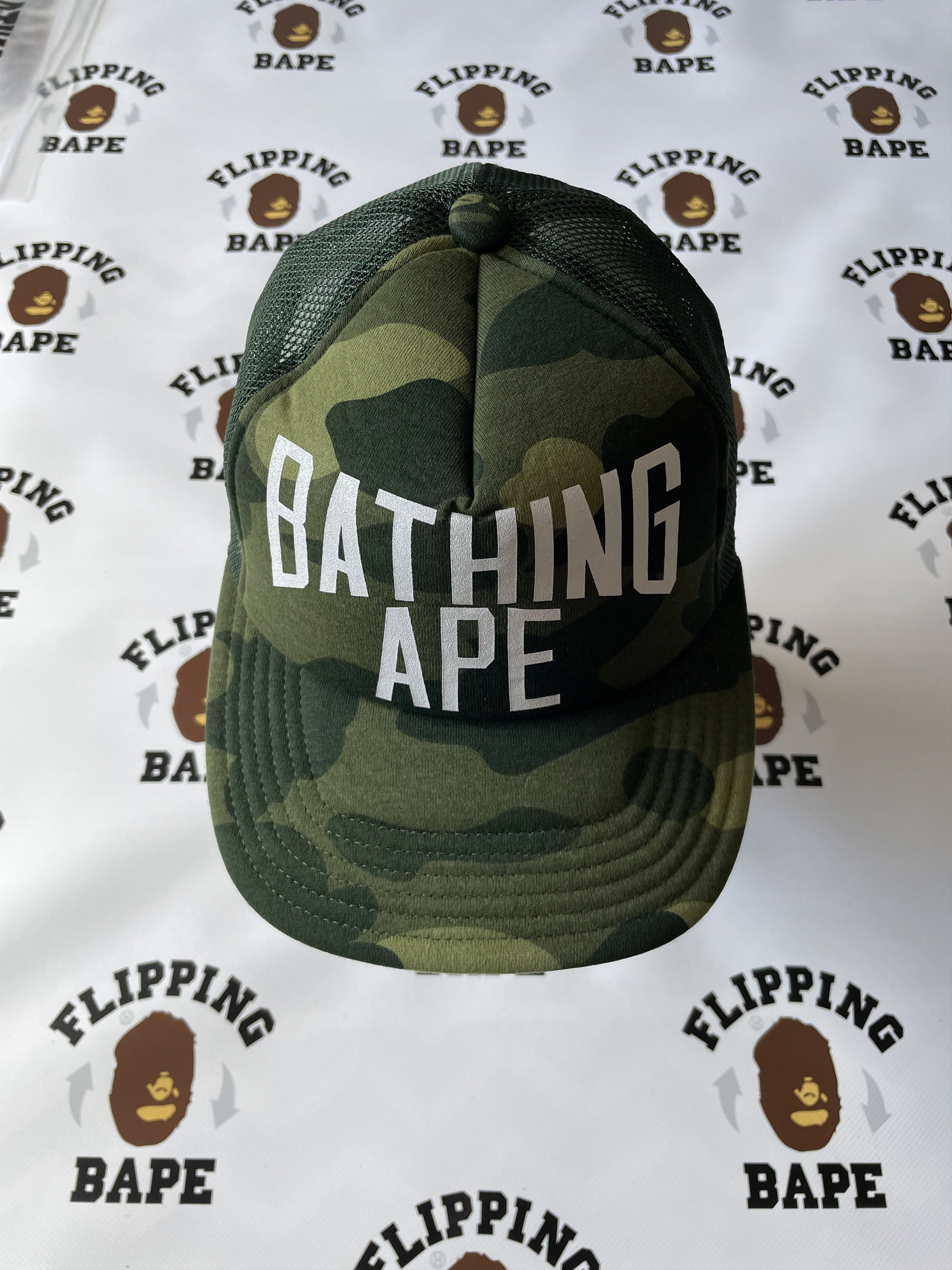 image of Bape Color Camo Nyc Logo Mesh Cap in Green, Men's