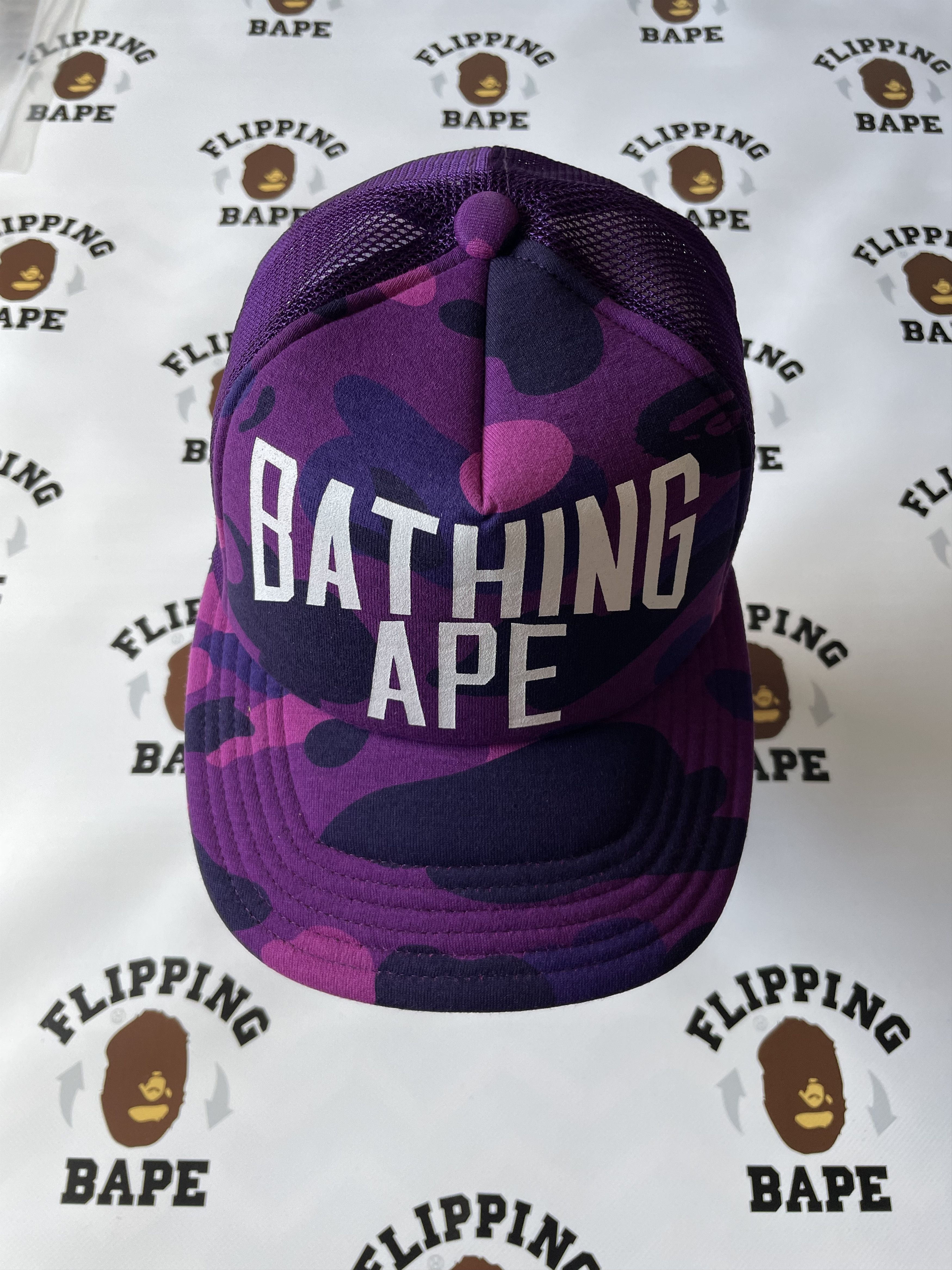 image of Bape Color Camo Nyc Logo Mesh Cap in Purple, Men's