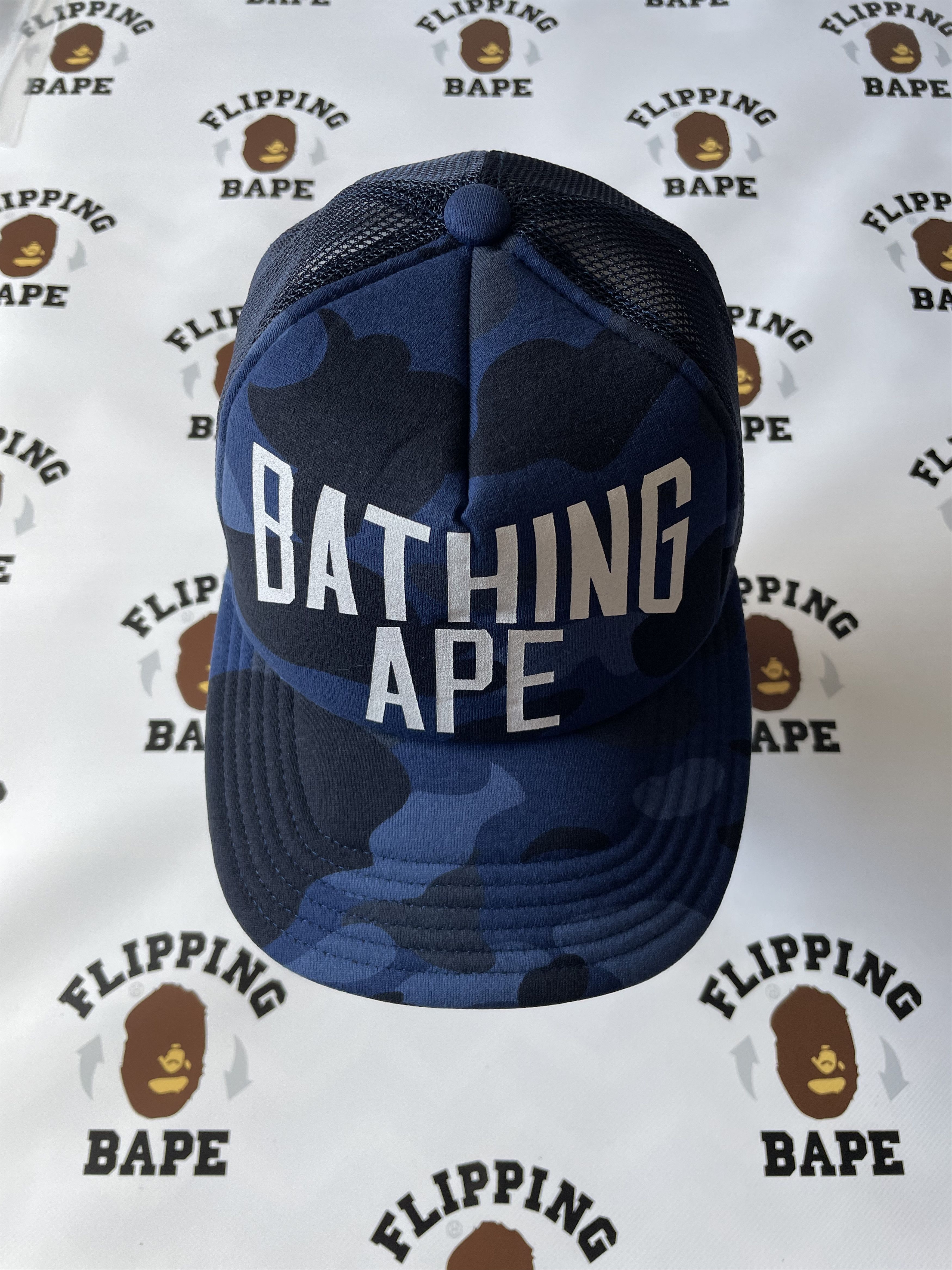 image of Bape Color Camo Nyc Logo Mesh Cap in Navy, Men's