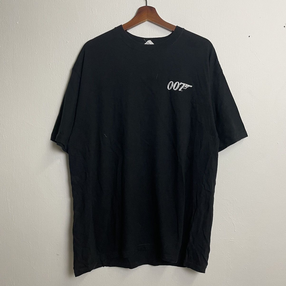 image of Movie x Vintage 007 James Bond Small Logo T-Shirt in Black, Men's (Size Large)