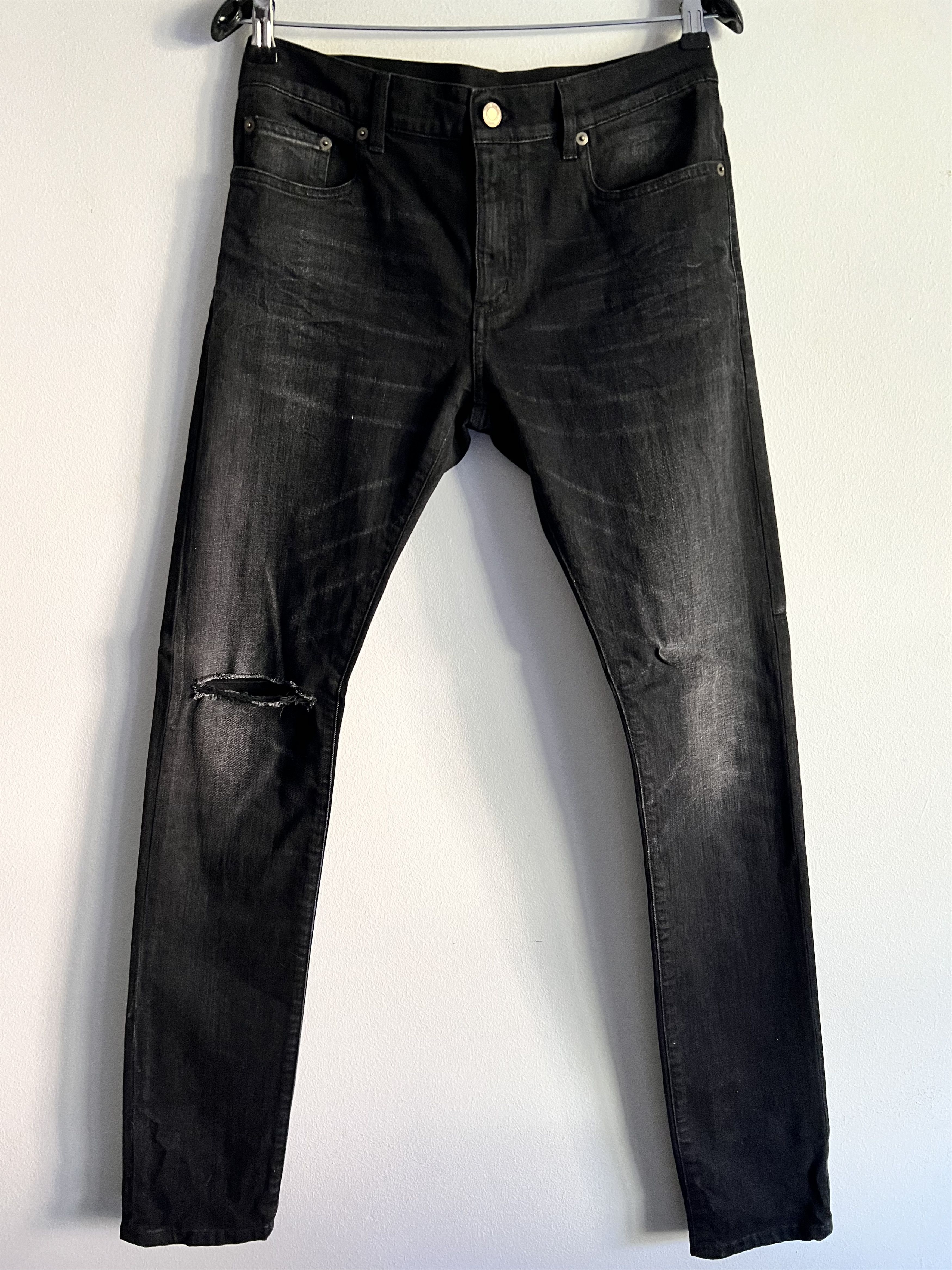 image of Saint Laurent Paris Scratch On The Knee Slim Fit in Black Denim, Men's (Size 32)