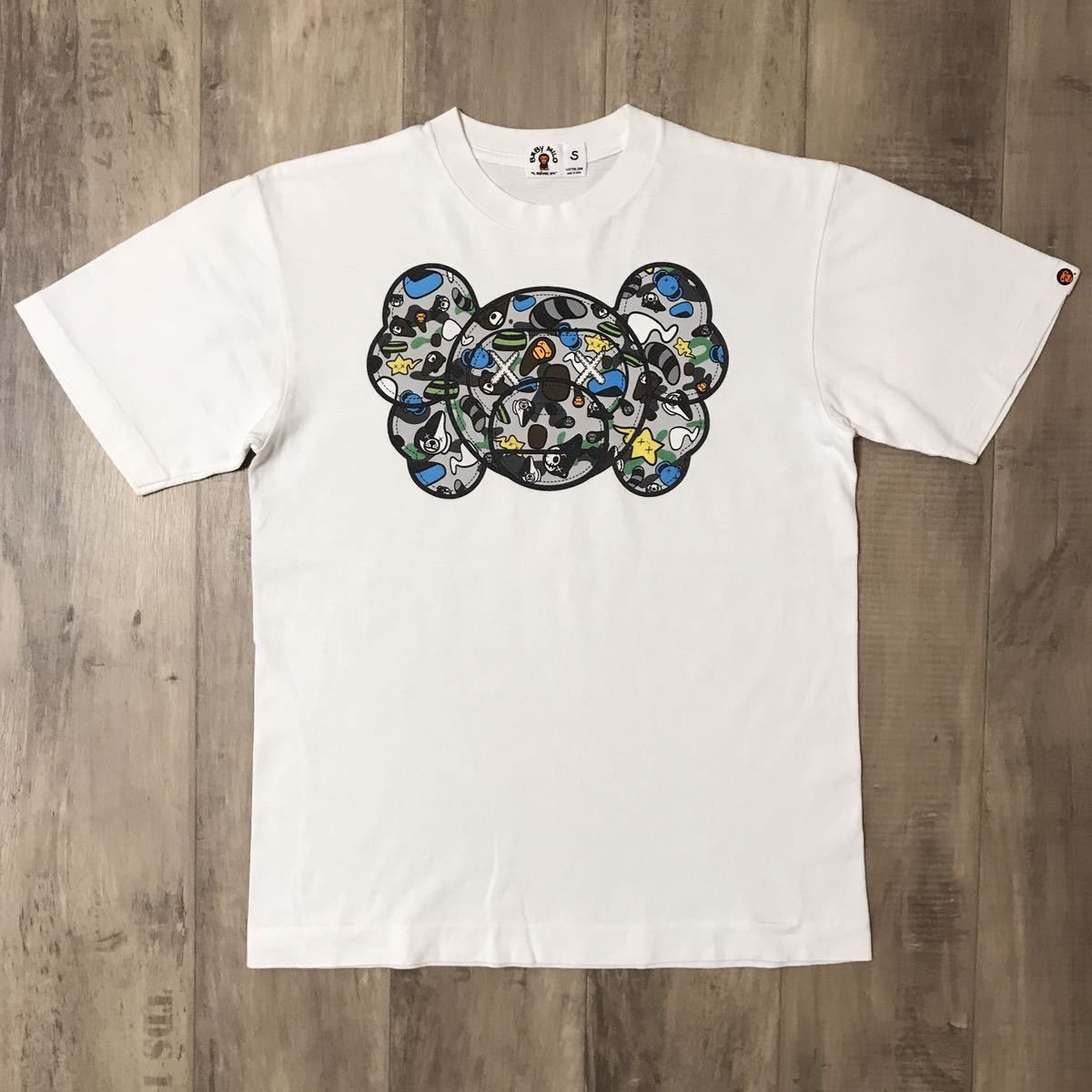 image of Bape × Kaws Milo Animal Kingdom T-Shirt in White, Men's (Size Small)